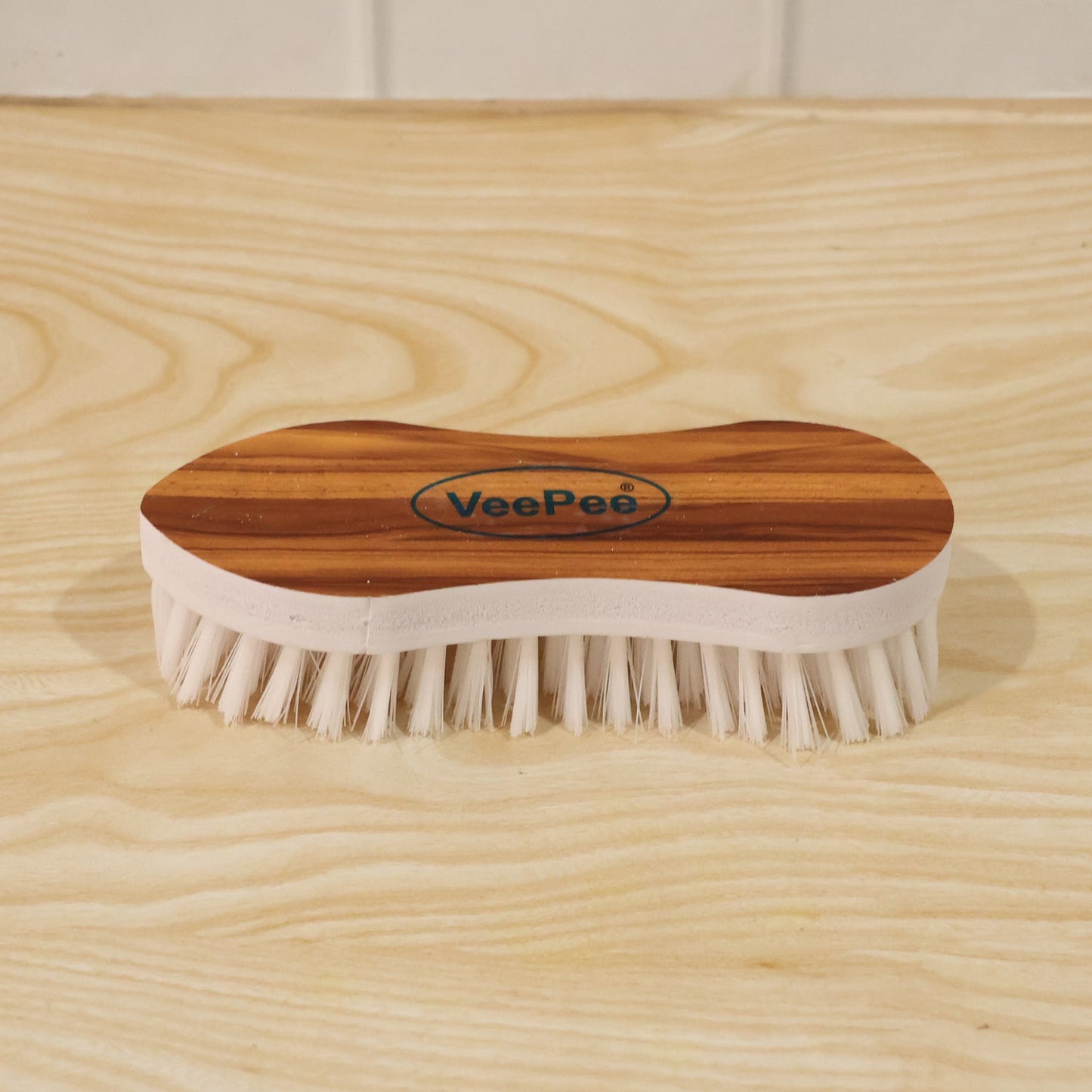Close-up of cloth washing brush with nylon bristles and ergonomic grip