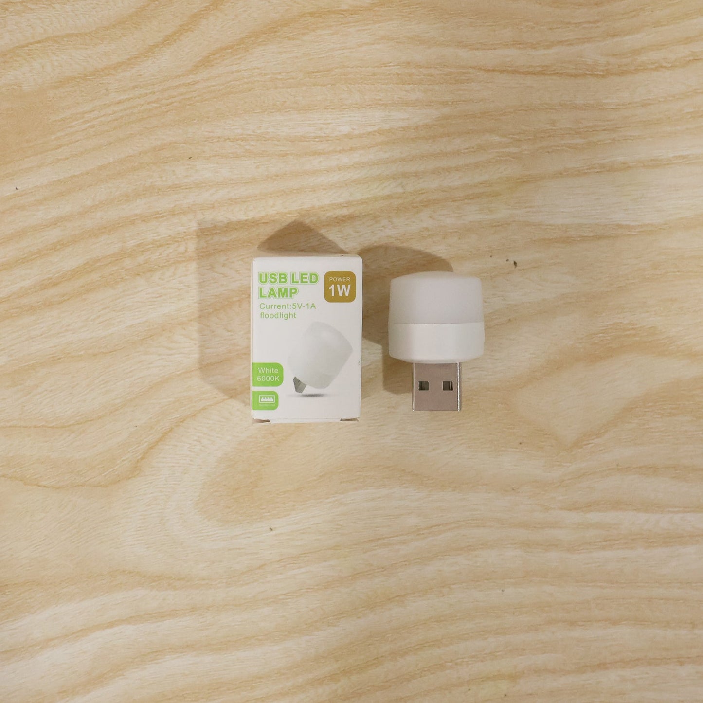 USB LED night light shining warm glow in a dark room