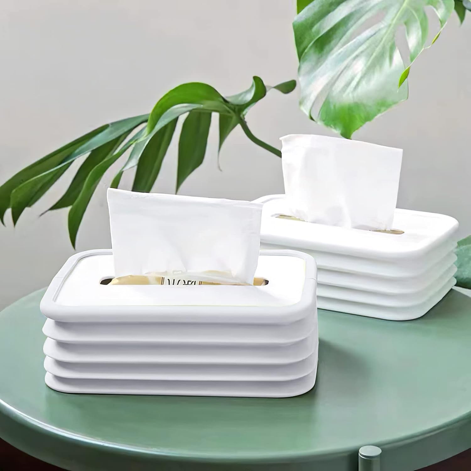 Modern silicone tissue holder with wave design on an office desk.