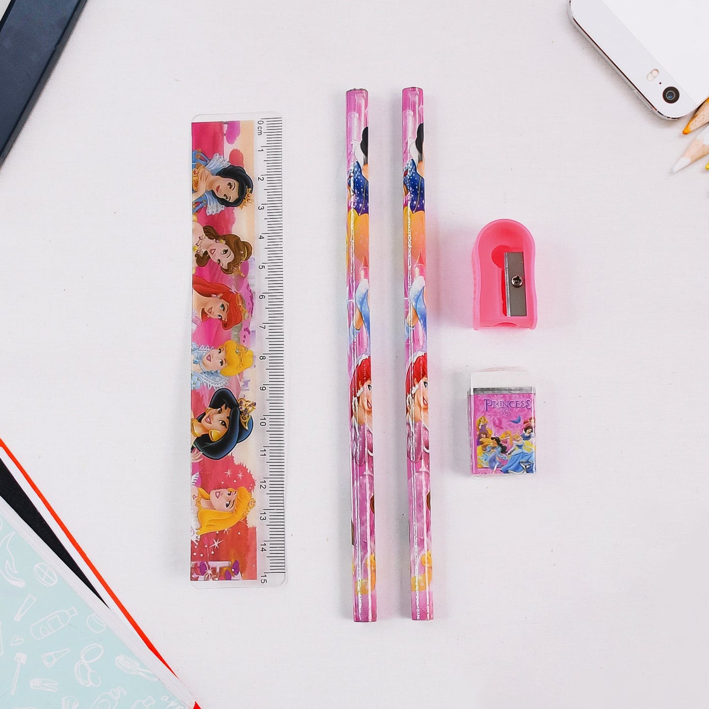 Close-up of the Cartoon Wooden Pencil Set showing a pencil, ruler, sharpener, and eraser.
