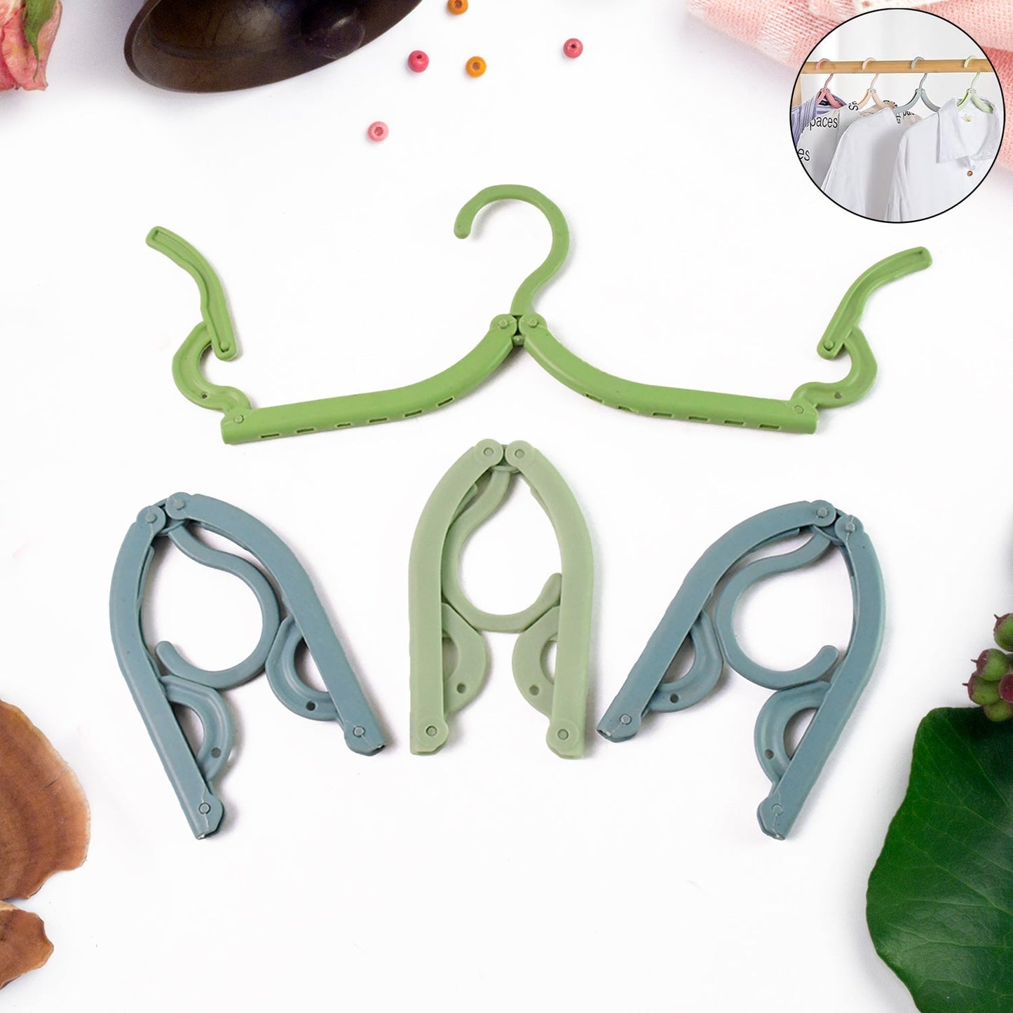 Foldable travel hangers hanging clothes in hotel room closet