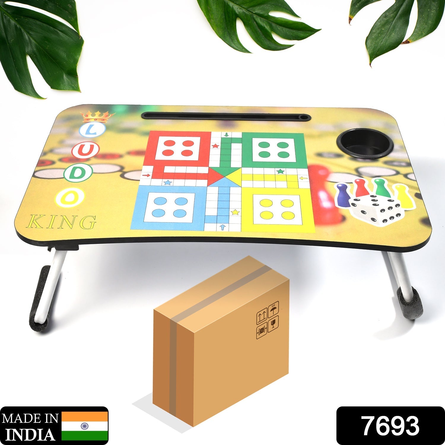 Portable Ludo laptop desk for kids comfortably set up on a bed.