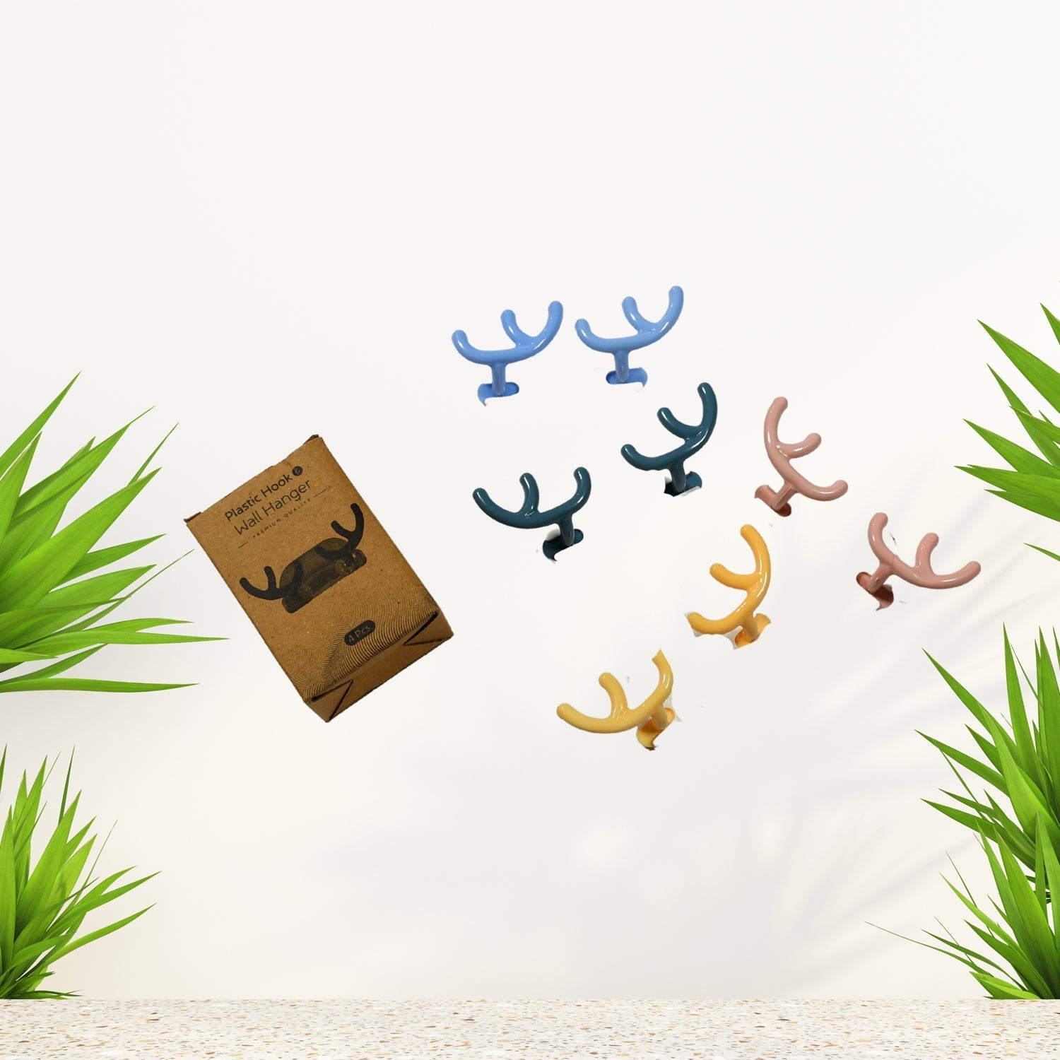 A pack of four white self-adhesive wall hooks, ready for easy installation.