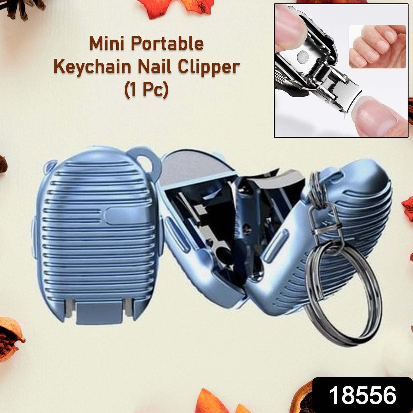 Compact keychain nail clipper attached to a set of keys for portability.