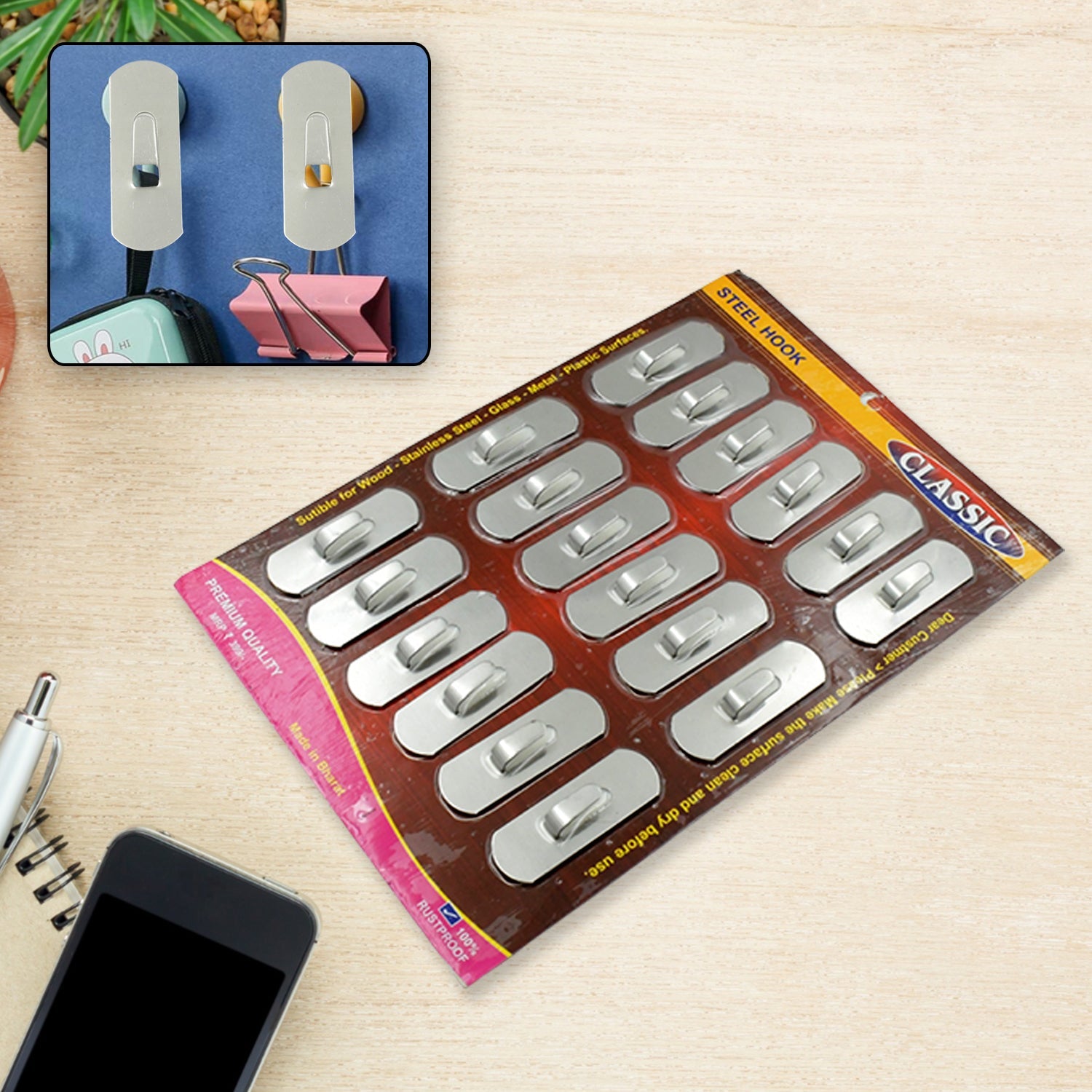 Multipurpose stainless steel wall hooks displayed on a clean surface.