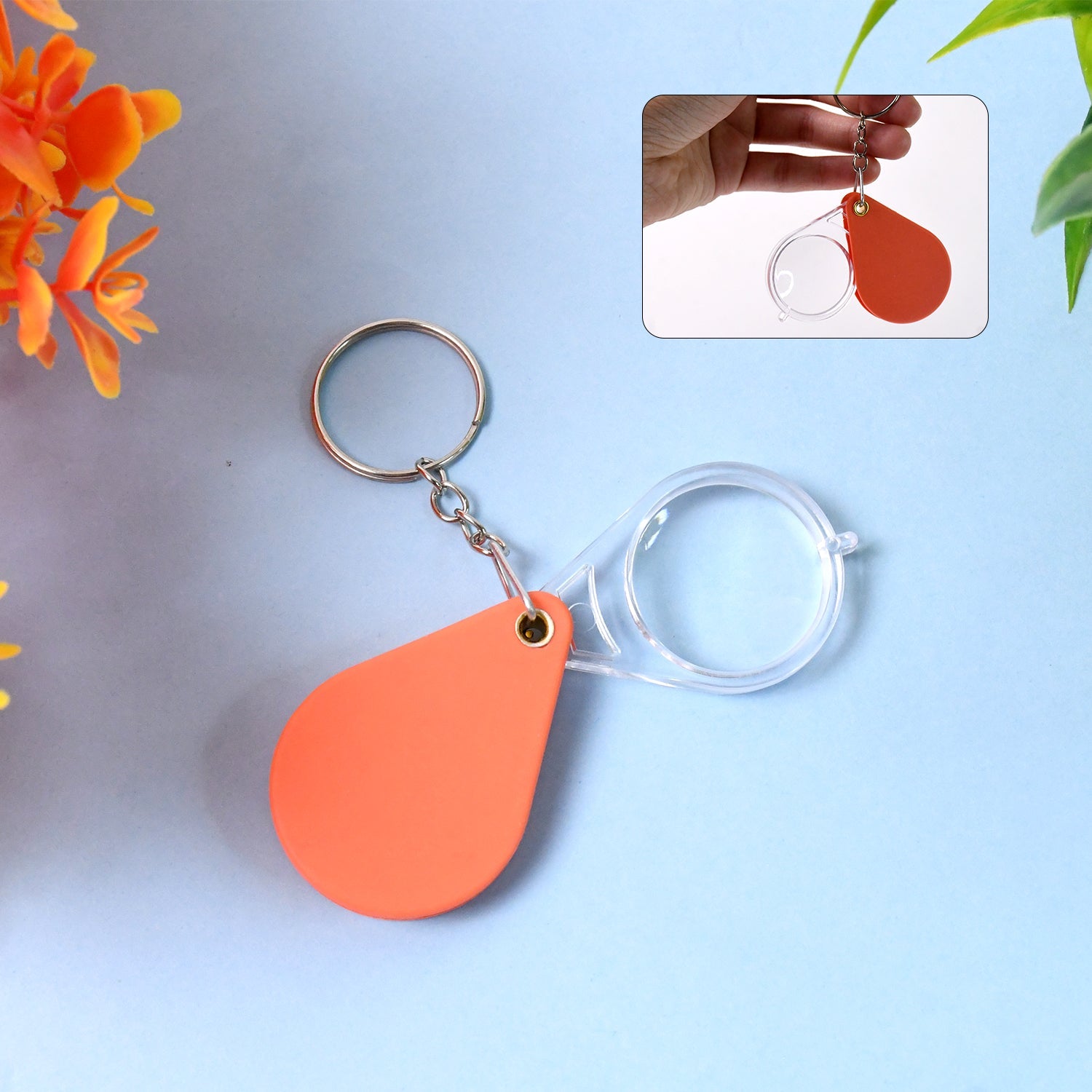 Orange portable folding magnifier keychain with clear optical glass lens