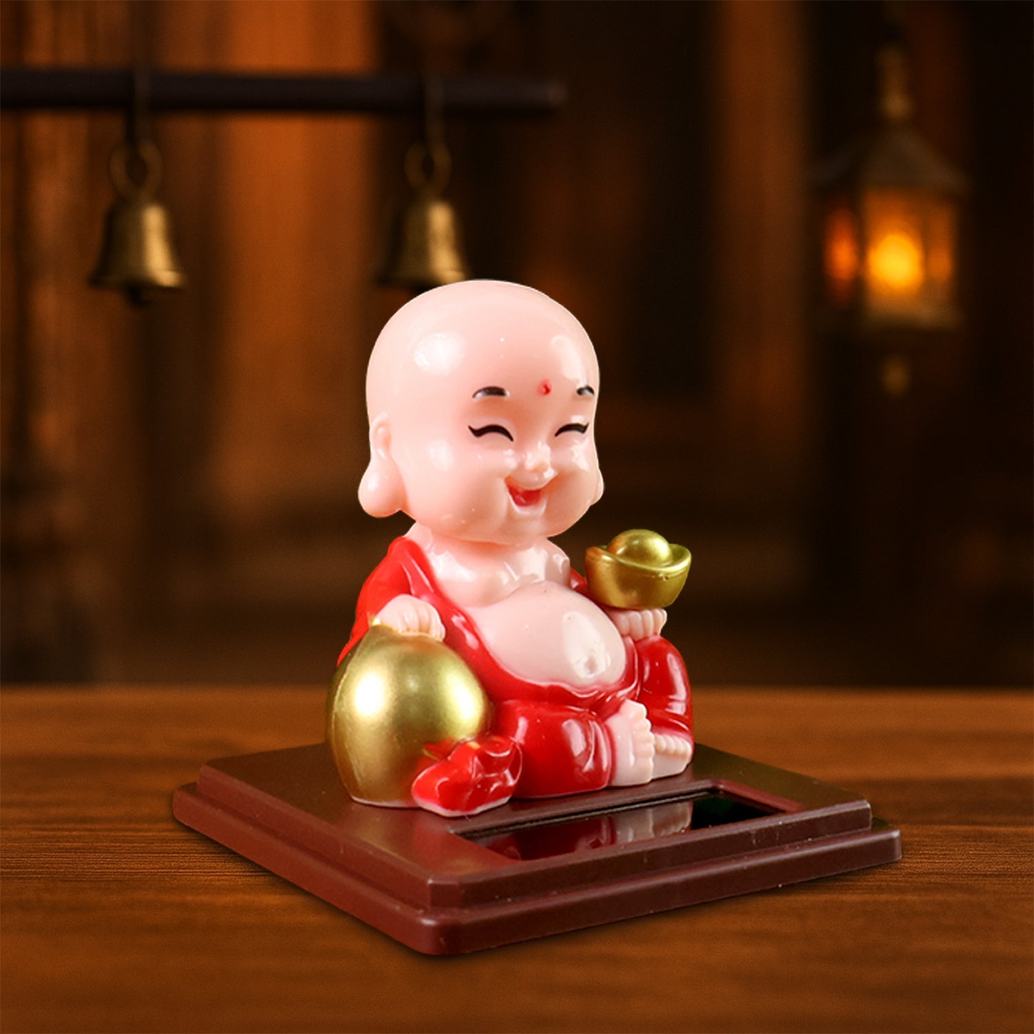 Colourful Solar Buddha Car Ornament with a gently nodding head, perfect for dashboard decor.
