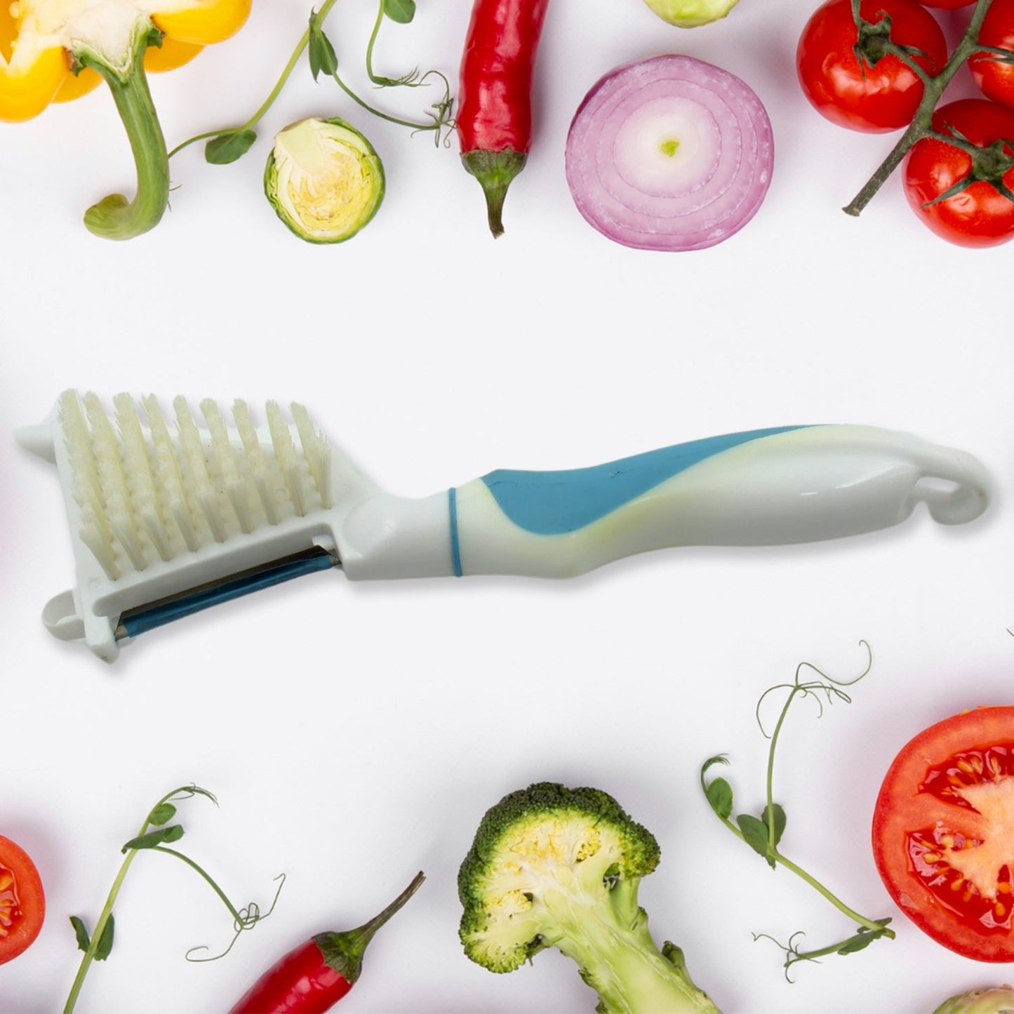 An Indian chef using the multipurpose peeler brush to prepare vegetables efficiently.