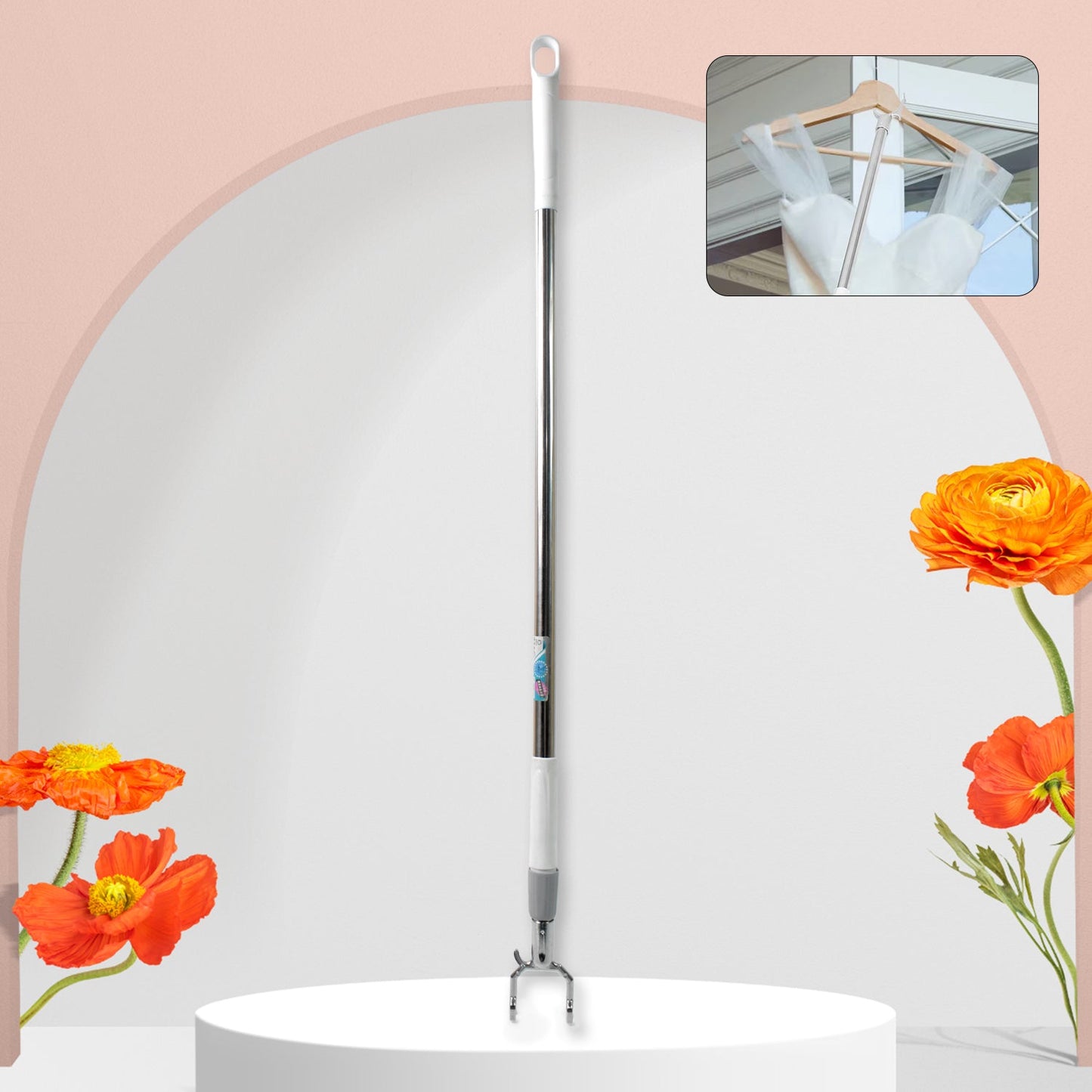 Telescopic clothes hook extended, reaching high garments in a closet.