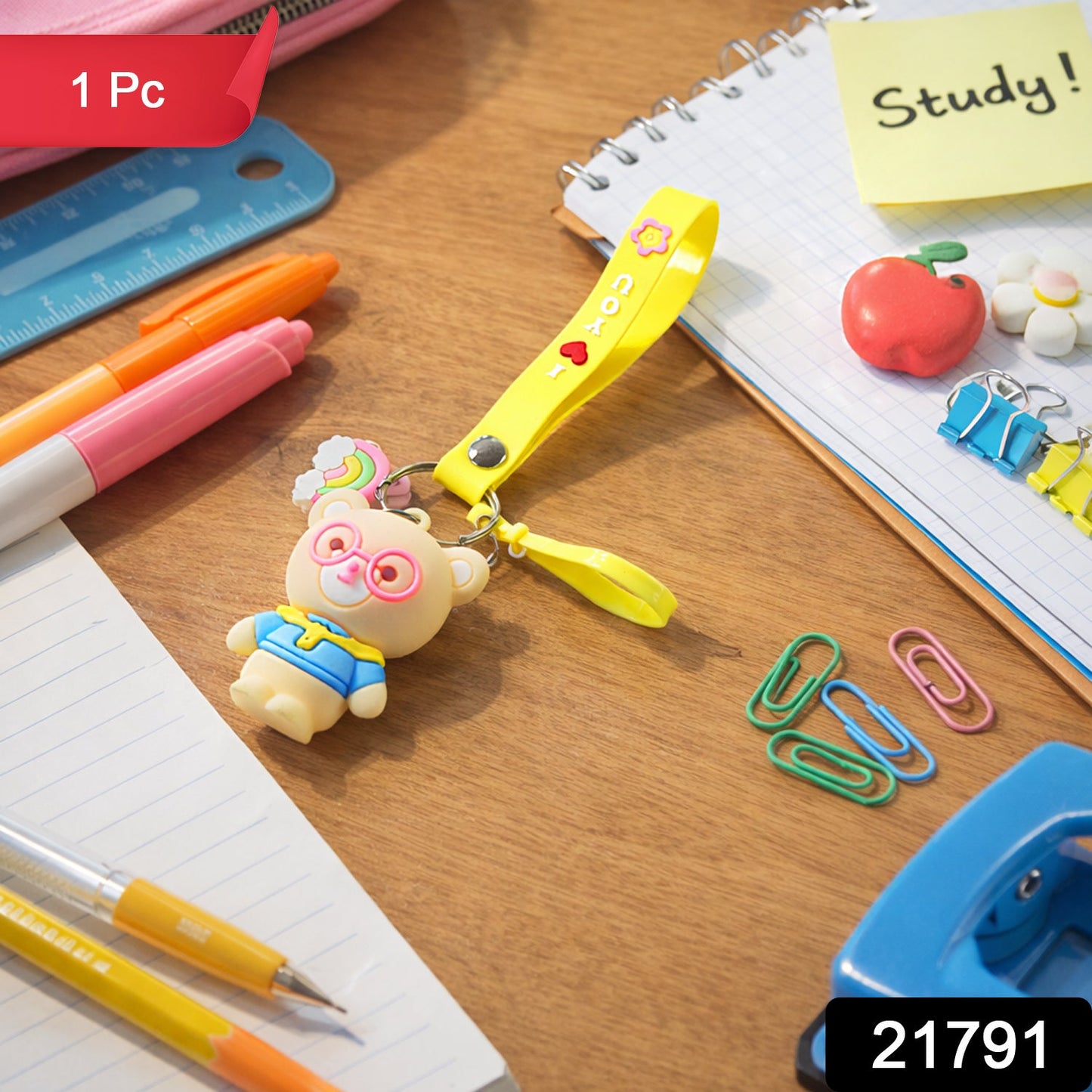Close-up of teddy bear keychain showcasing cartoon design and vibrant yellow silicone loop strap
