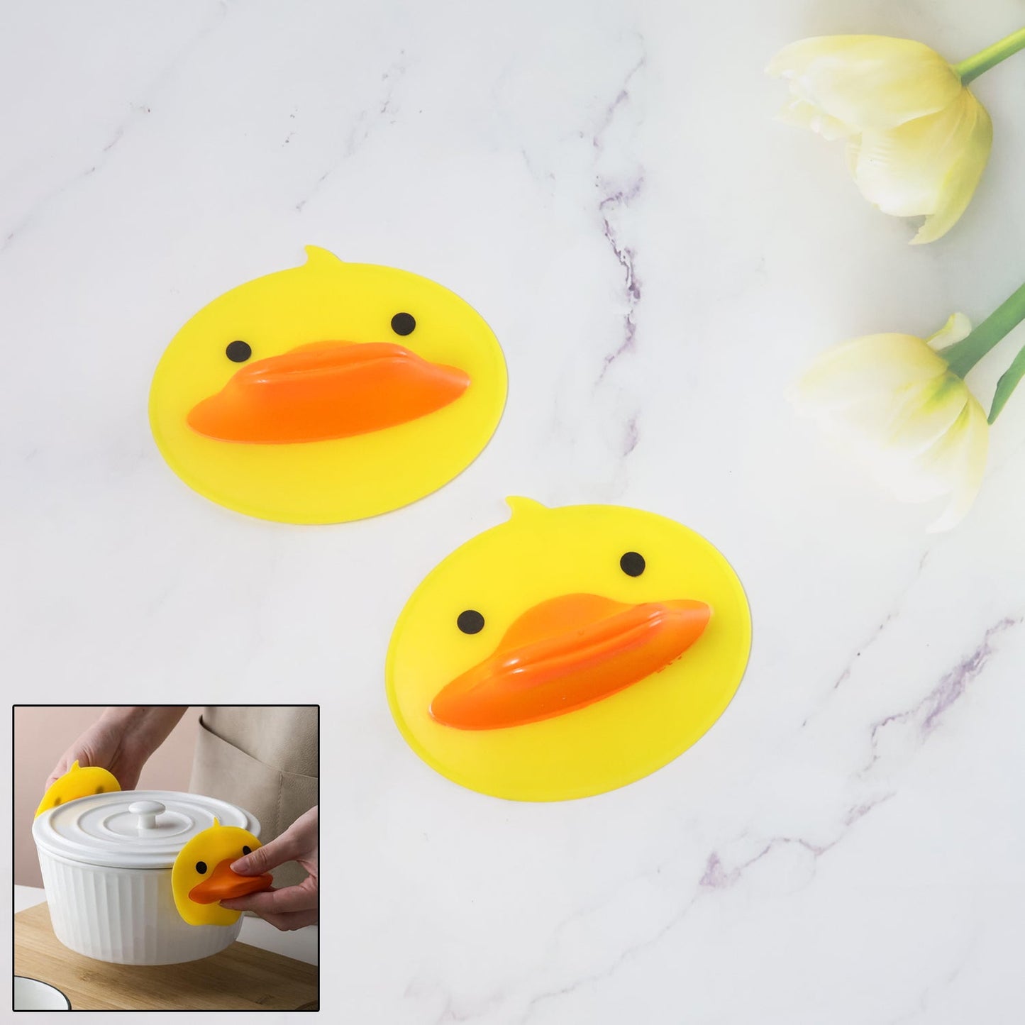 Duck silicone hot pot holder lifting a hot pot lid with secure grip
