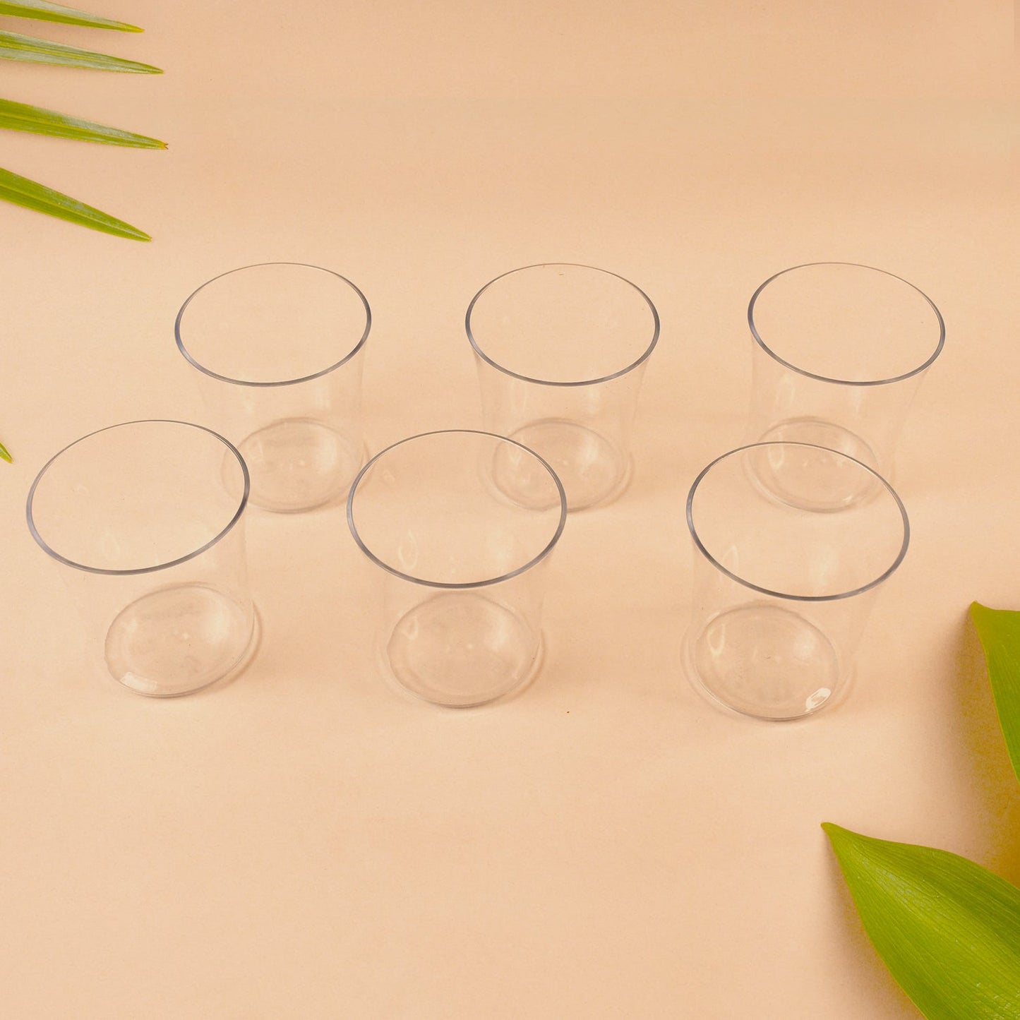 Close view of warm welcome tumbler set with clear plastic glasses