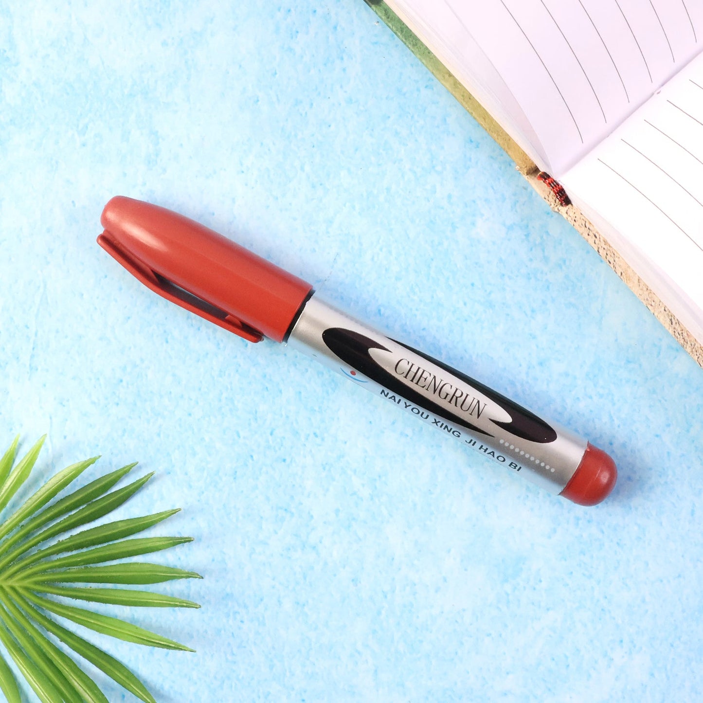 Maroon permanent marker pen showing smooth bold ink