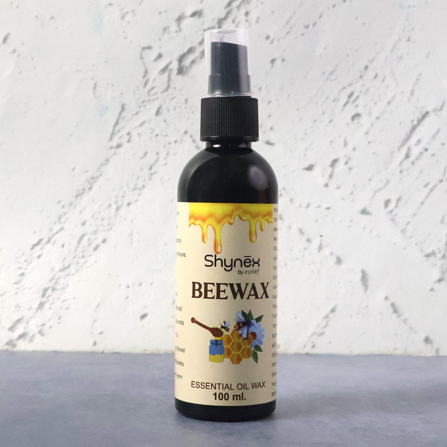 Beeswax Furniture Polish spray bottle highlighting natural ingredients for wood and leather care.
