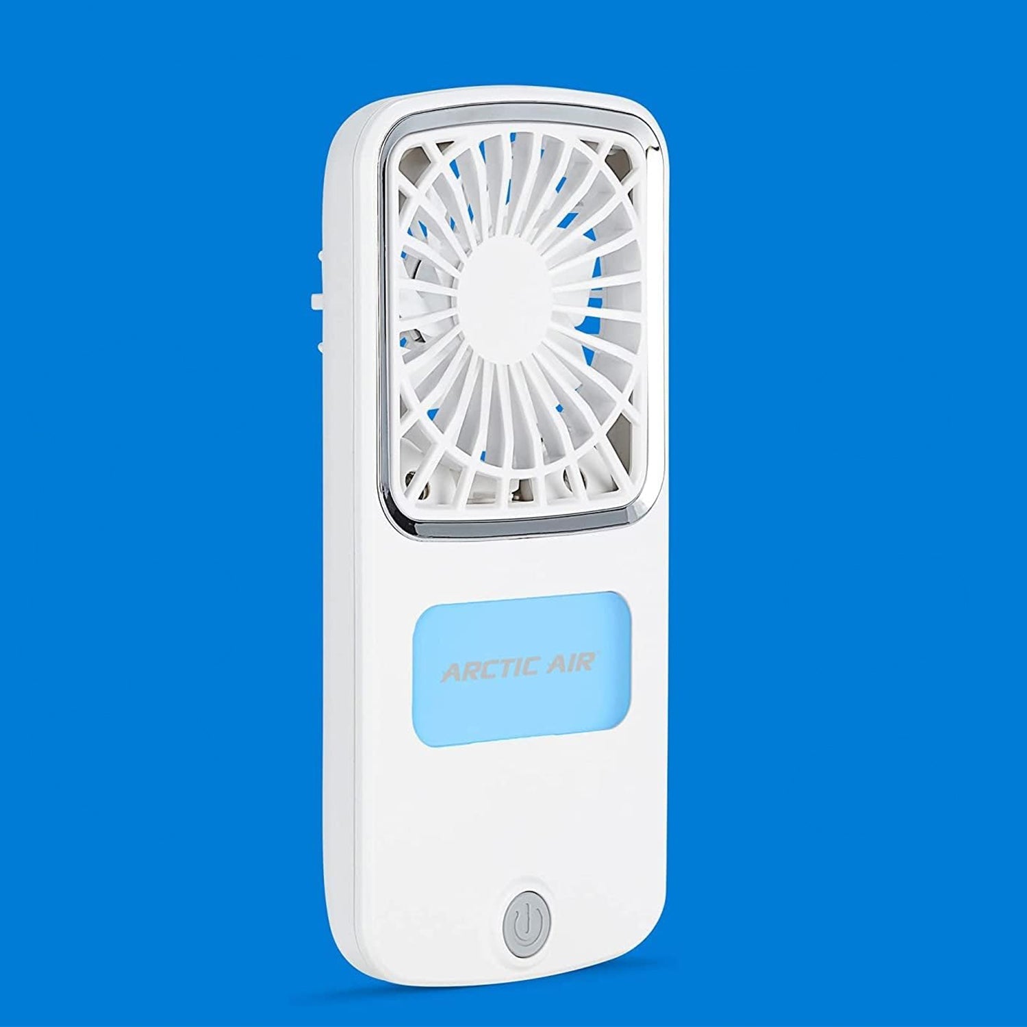 White portable personal air cooler on a table, ready for use indoors or outdoors.