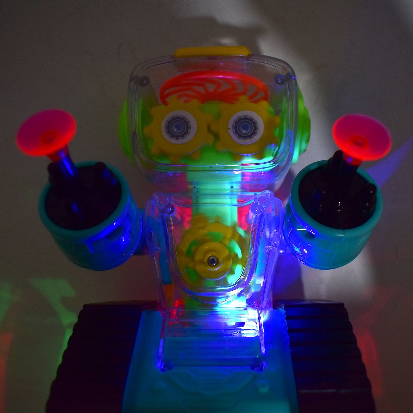 Side view of the transparent gear robot car showcasing its vibrant internal gears and robust design.