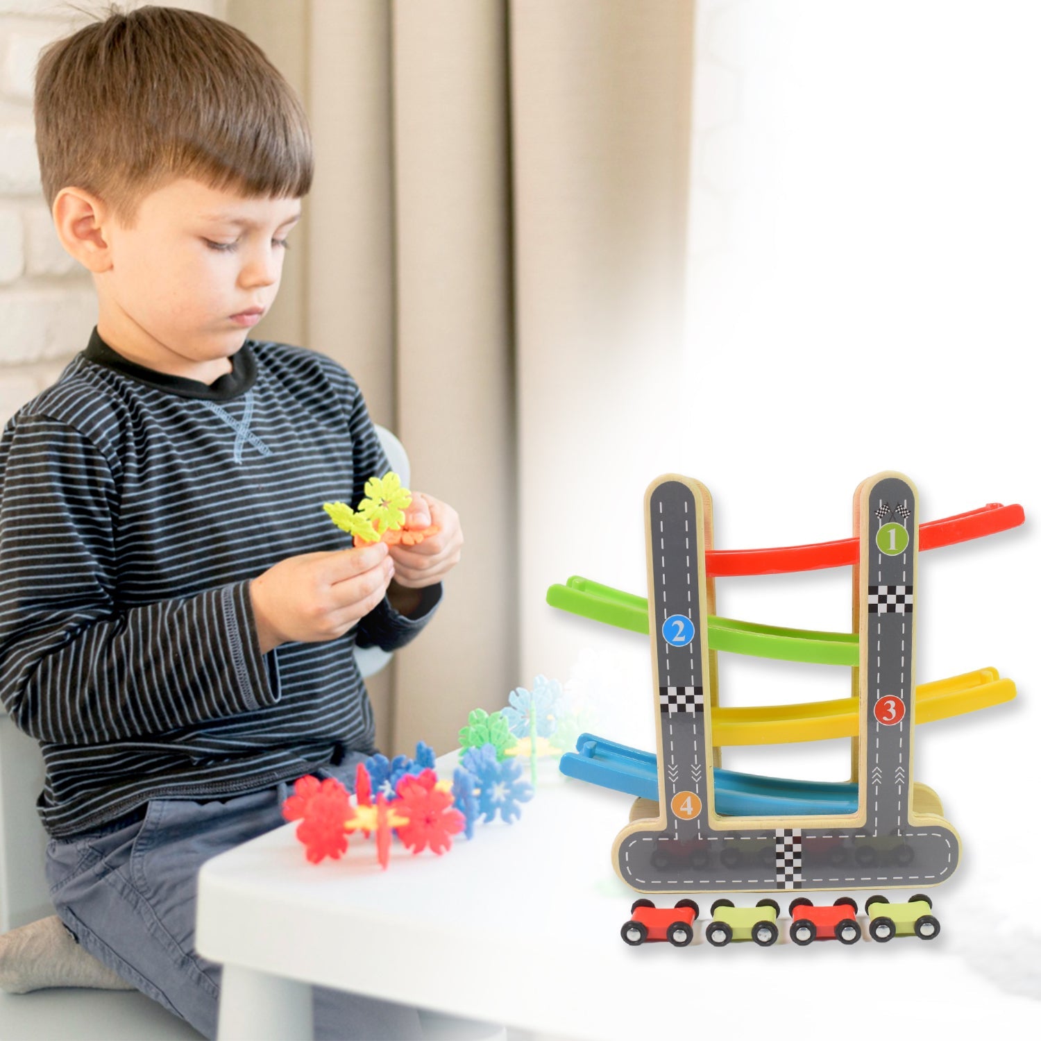 Close-up of the durable wooden ramp racer track with mini cars in action.