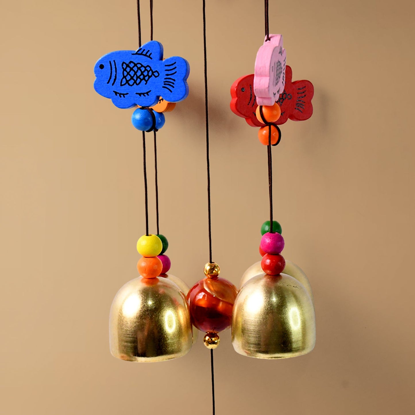 Handmade dragonfly wind chime producing tranquil tones in backyard
