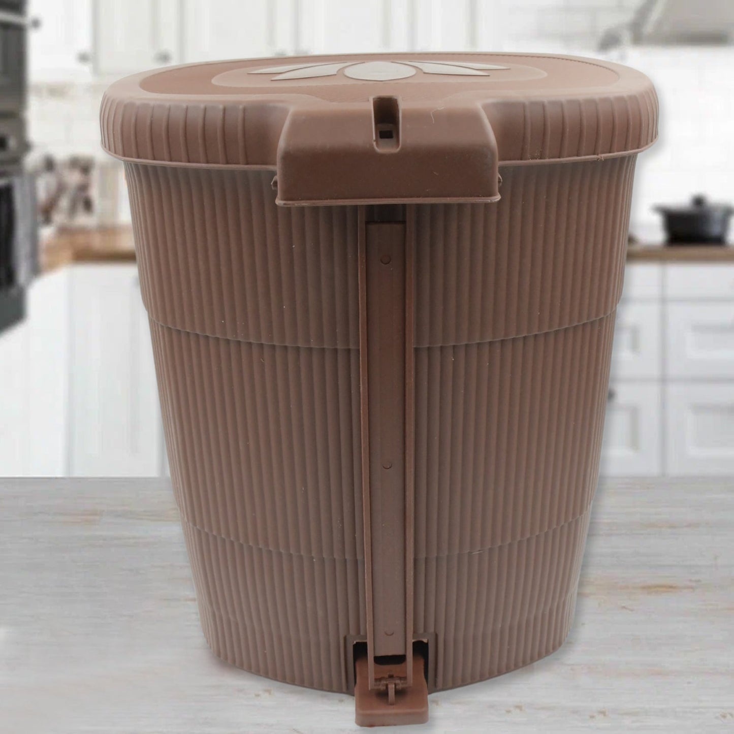 Sleek mini pedal dustbin discreetly positioned in an office workspace.