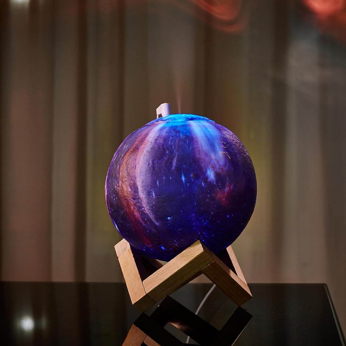3D Moon Lamp Diffuser displayed with its wooden stand and USB power cable