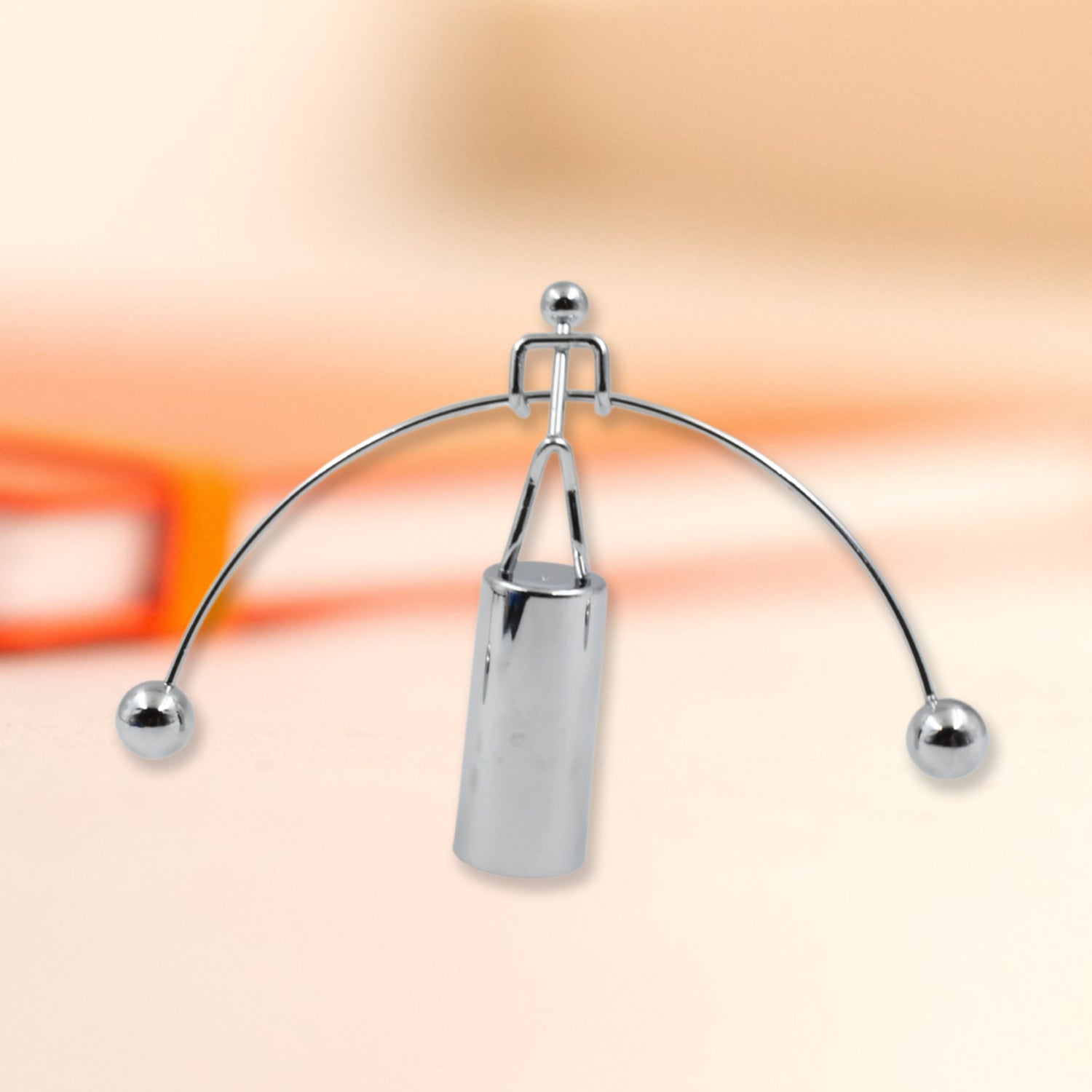 Elegant metal balance desk toy, a classic physics demonstration piece.