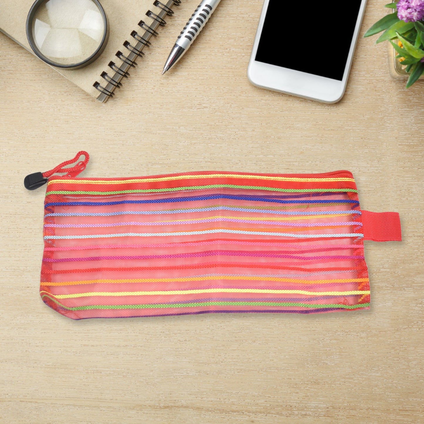 Flexible transparent mesh organizer pouch, ideal for storing small items.