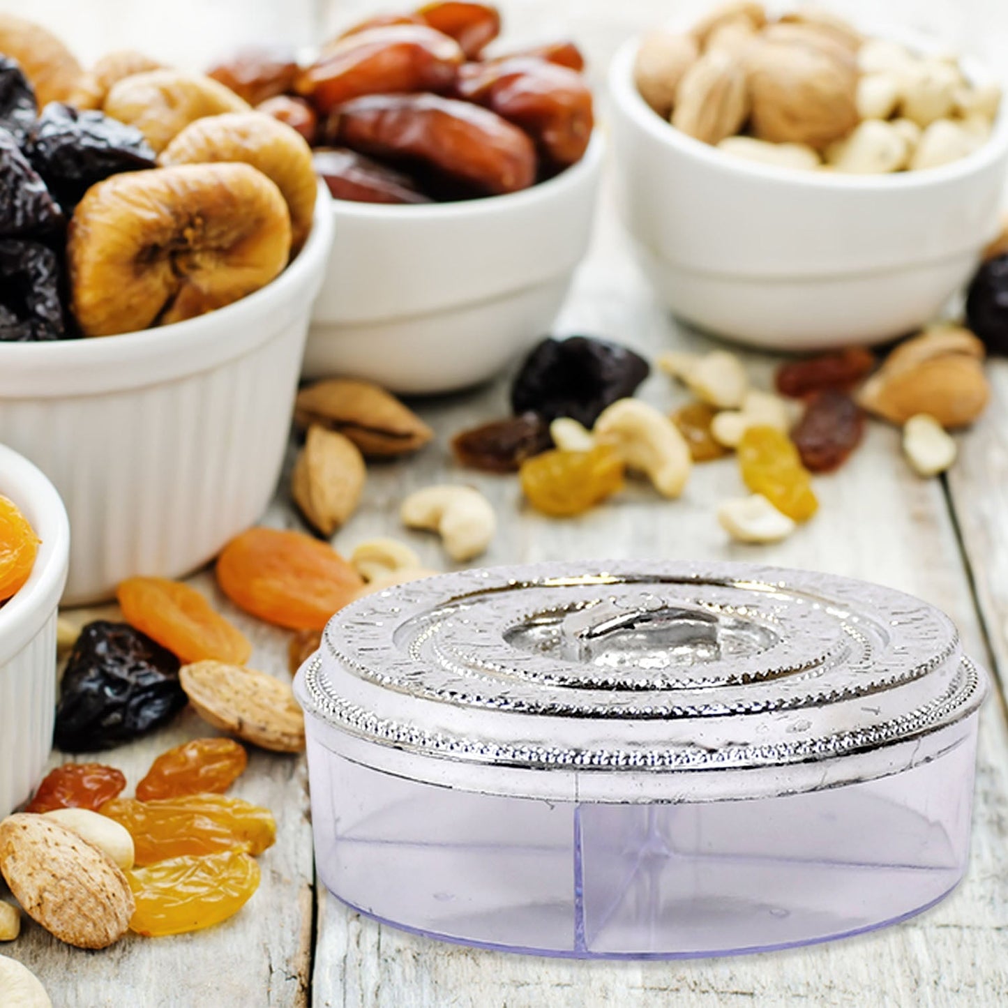 Smiling round dry fruit box with four clear compartments.