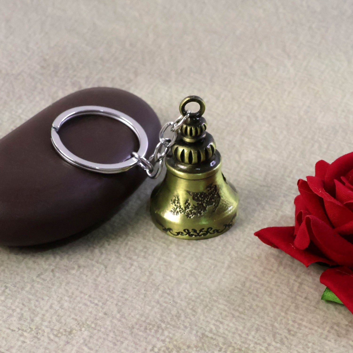 Close-up of Temple Bell Keychain highlighting durable metal charm