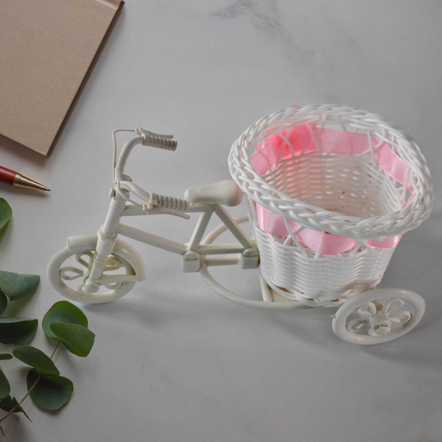 Side view of bicycle flower pot stand holding flowers