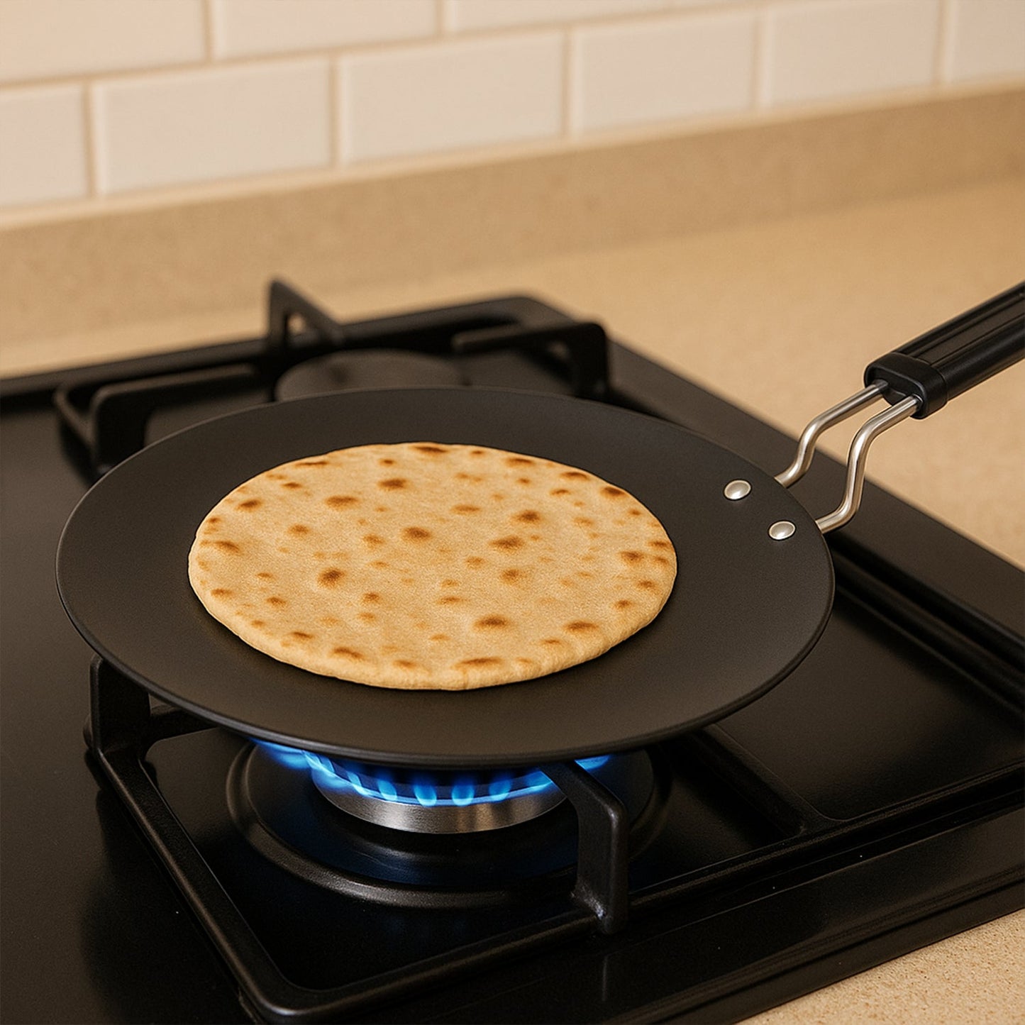 Black non-stick flat tawa ideal for chapati and dosa making