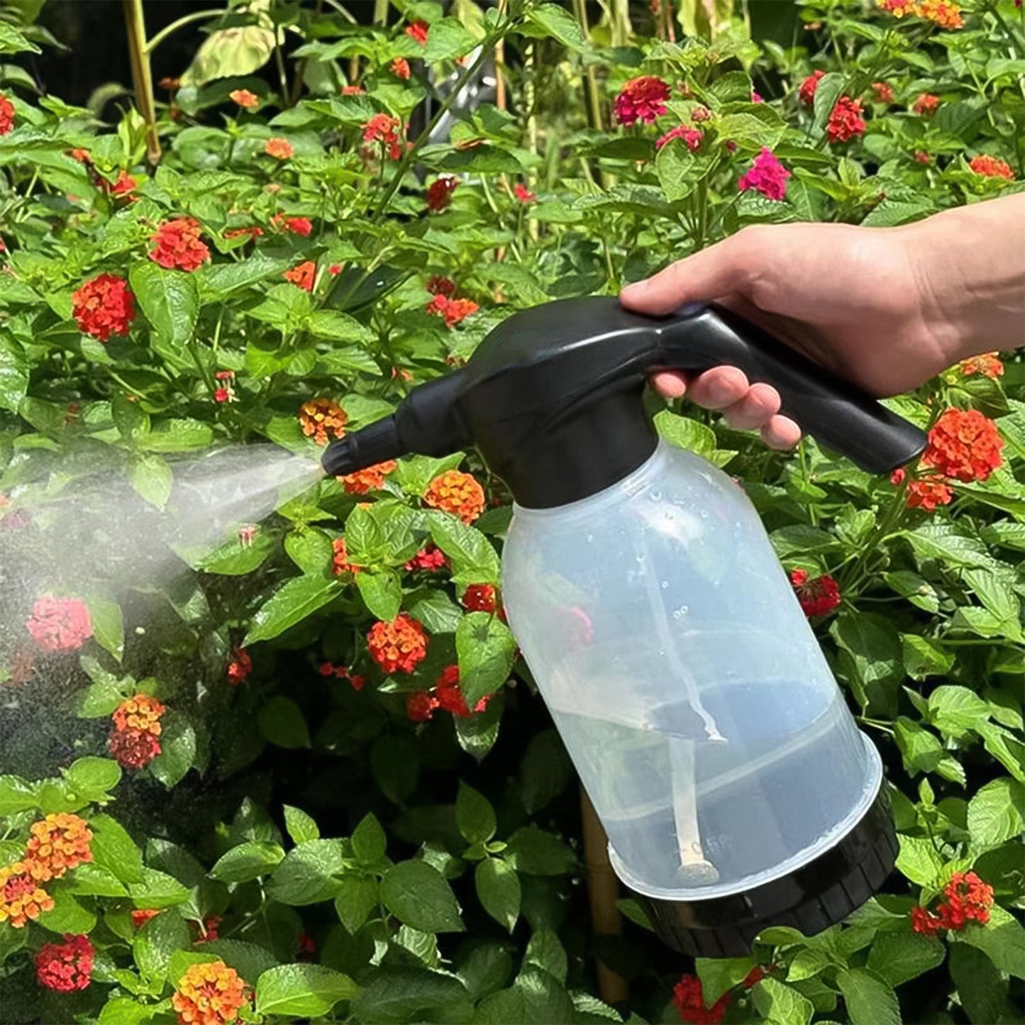 Automatic electric sprayer bottle with ergonomic handle for comfortable use.