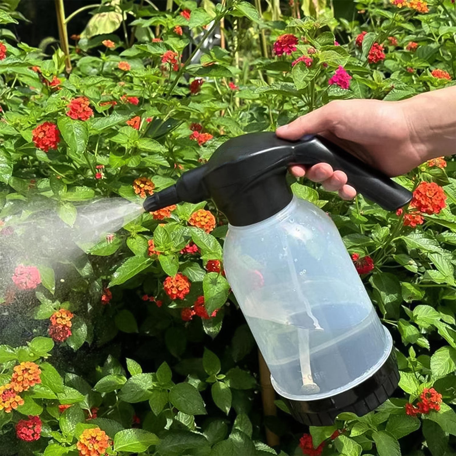 Automatic electric sprayer bottle with ergonomic handle for comfortable use.