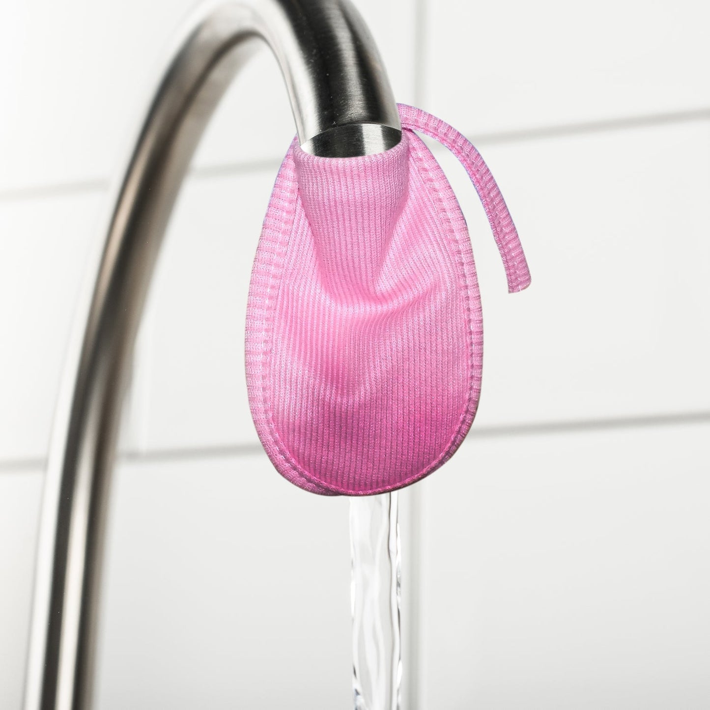 Double-layered cotton water filter cover protecting a faucet.