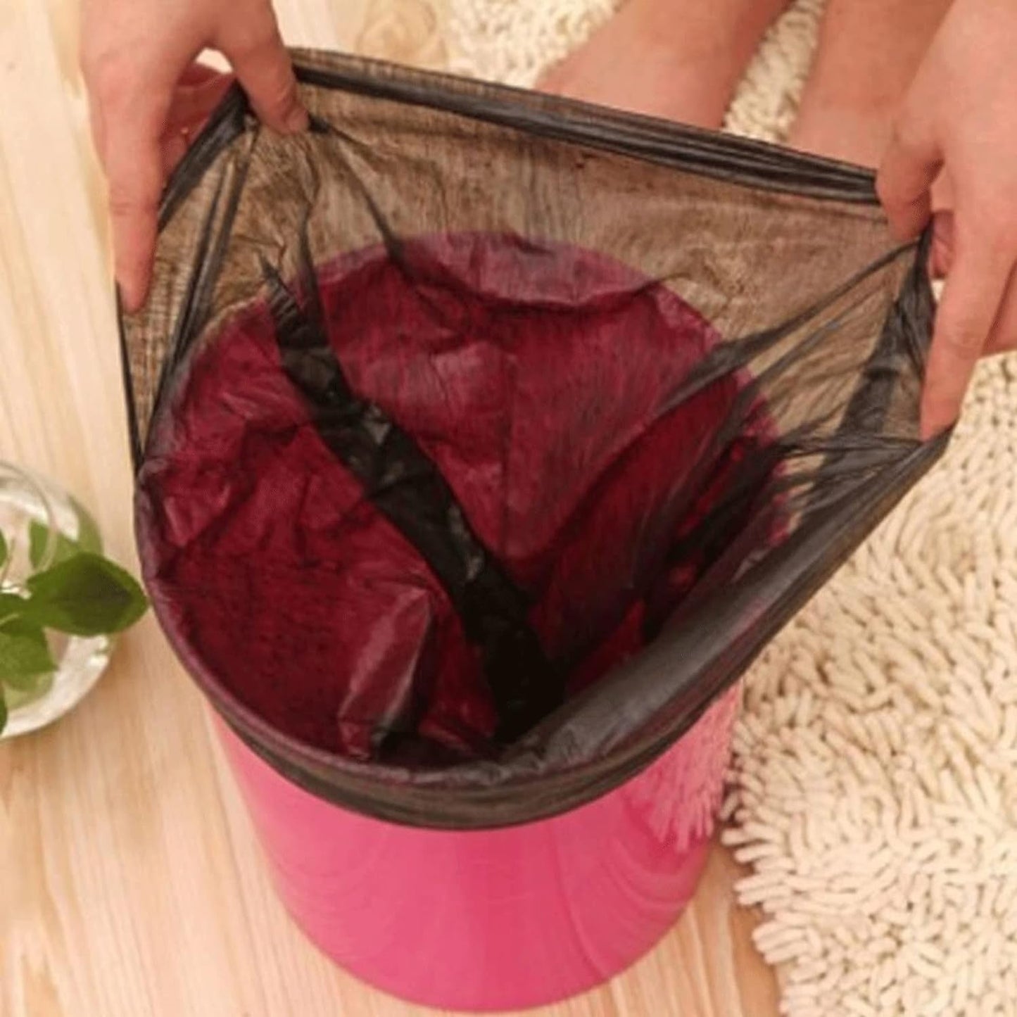 Close-up of a black dustbin bag, showcasing the strong, tear-resistant virgin raw material.