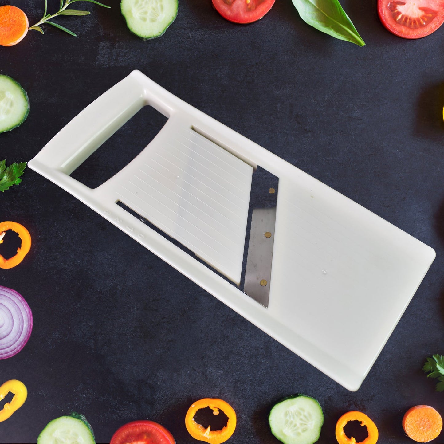 Adjustable vegetable slicer from Quickslice with its sharp stainless steel blade.