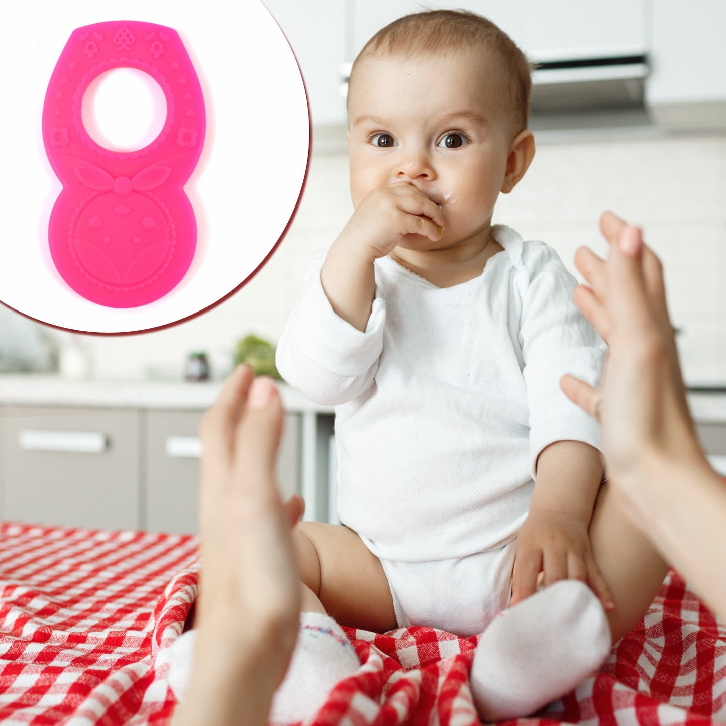 Close-up of a pink silicone teether, showcasing its flexible and safe material.