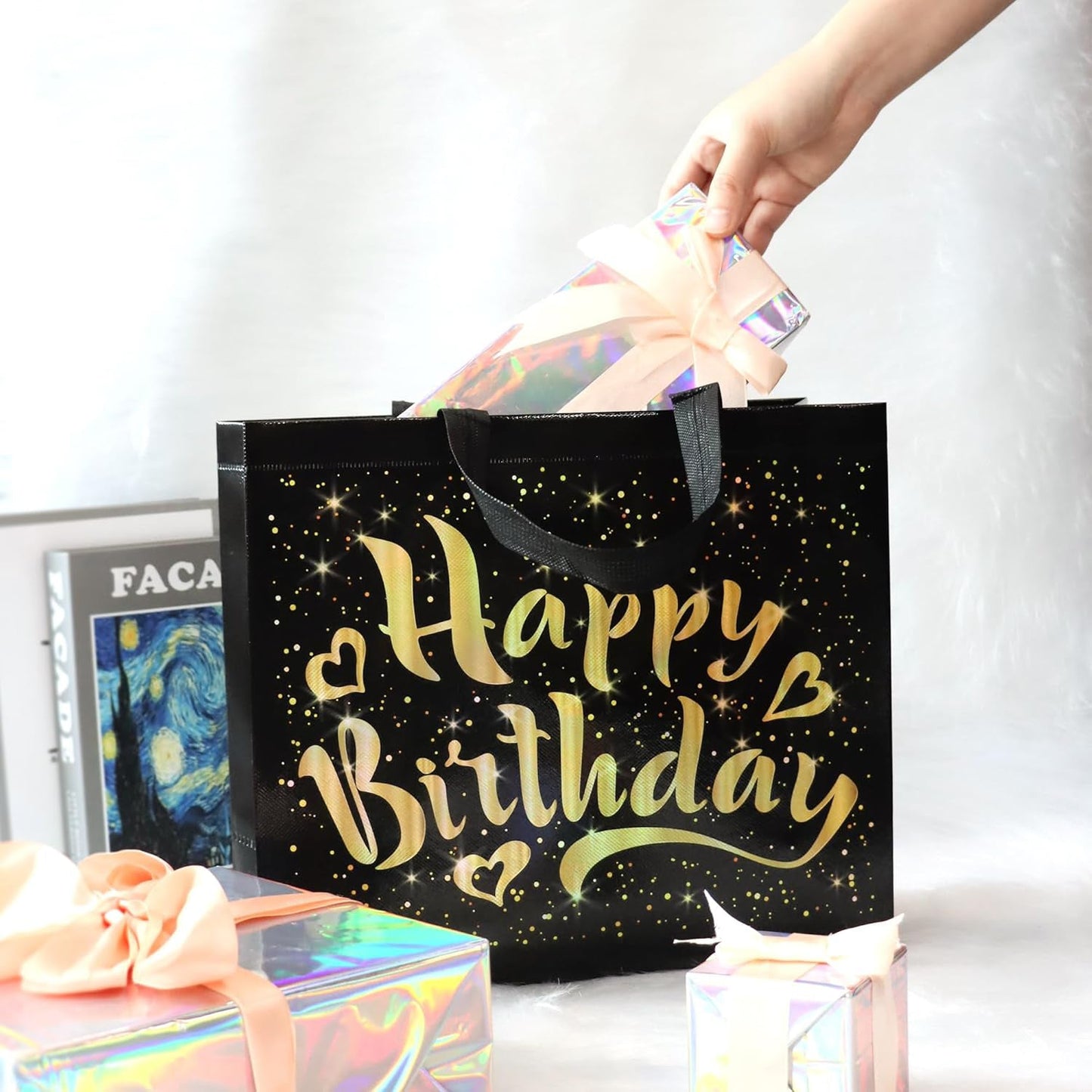 Close-up of golden star design on black reusable birthday gift bag