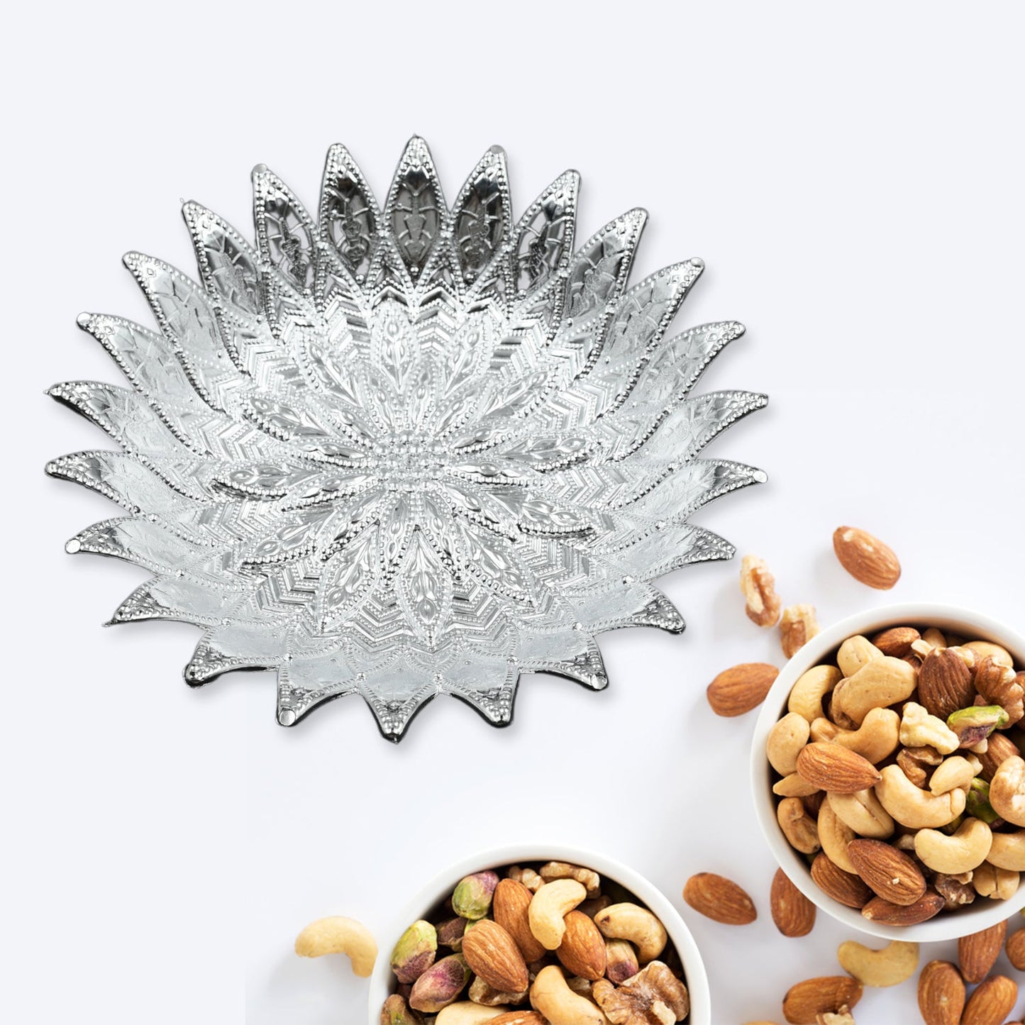 Decorative silver finish serving tray displaying mukhwas, perfect for Indian homes.