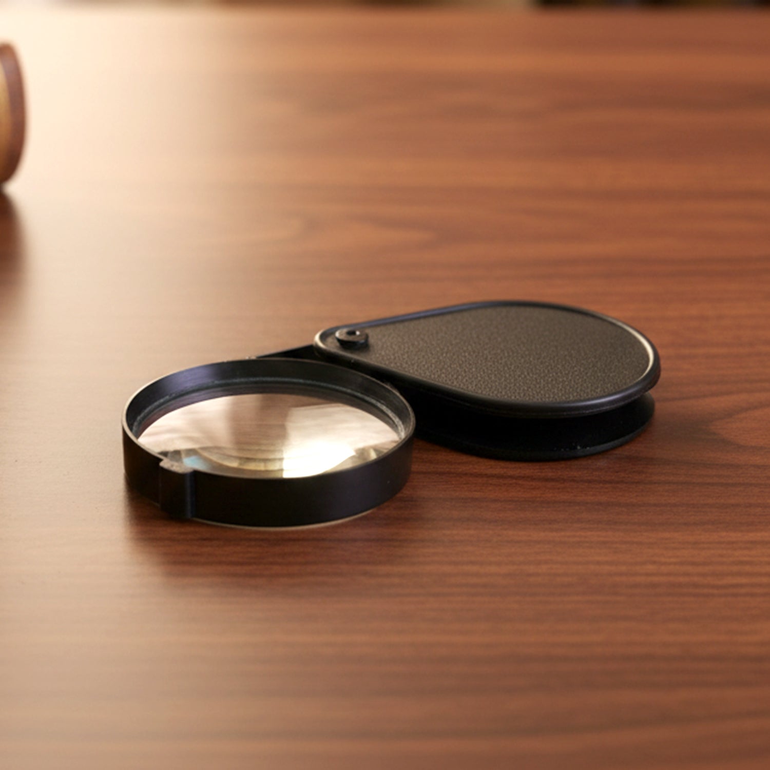 Pocket size magnifying tool with protective folding case