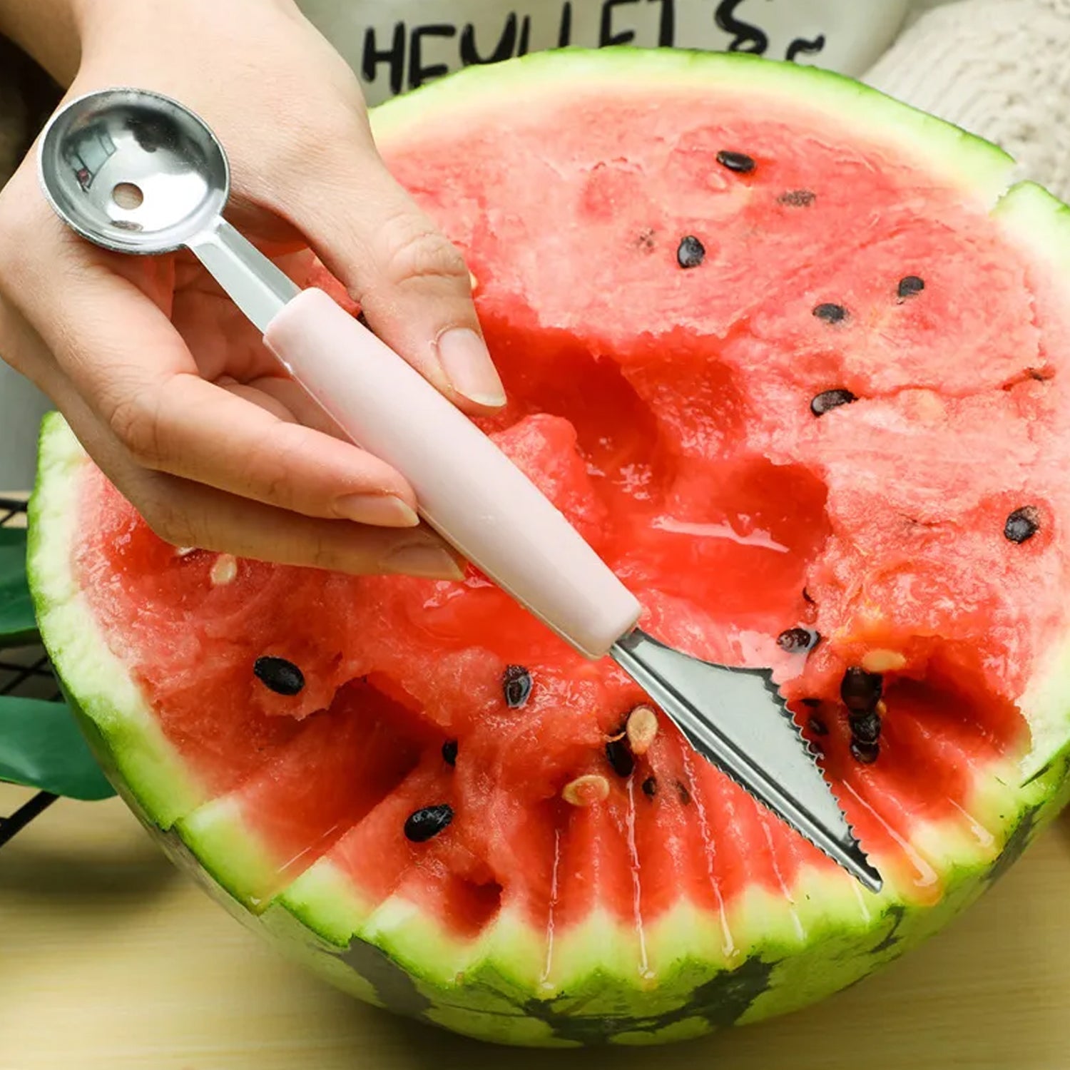 Various stainless steel fruit carving and peeling tools neatly arranged.