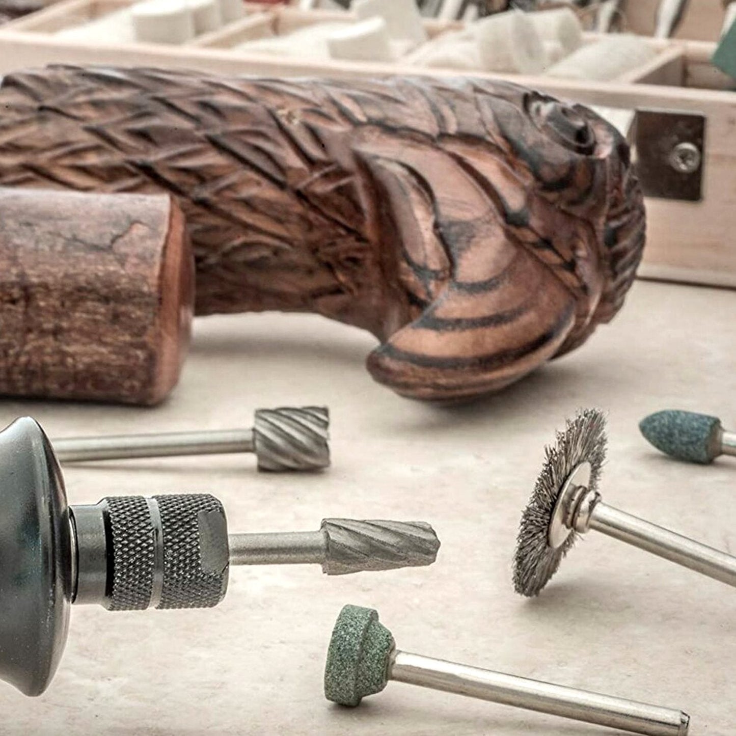 An organised view of the rotary tool accessory kit case, highlighting the compartments for different mini drill bit types.