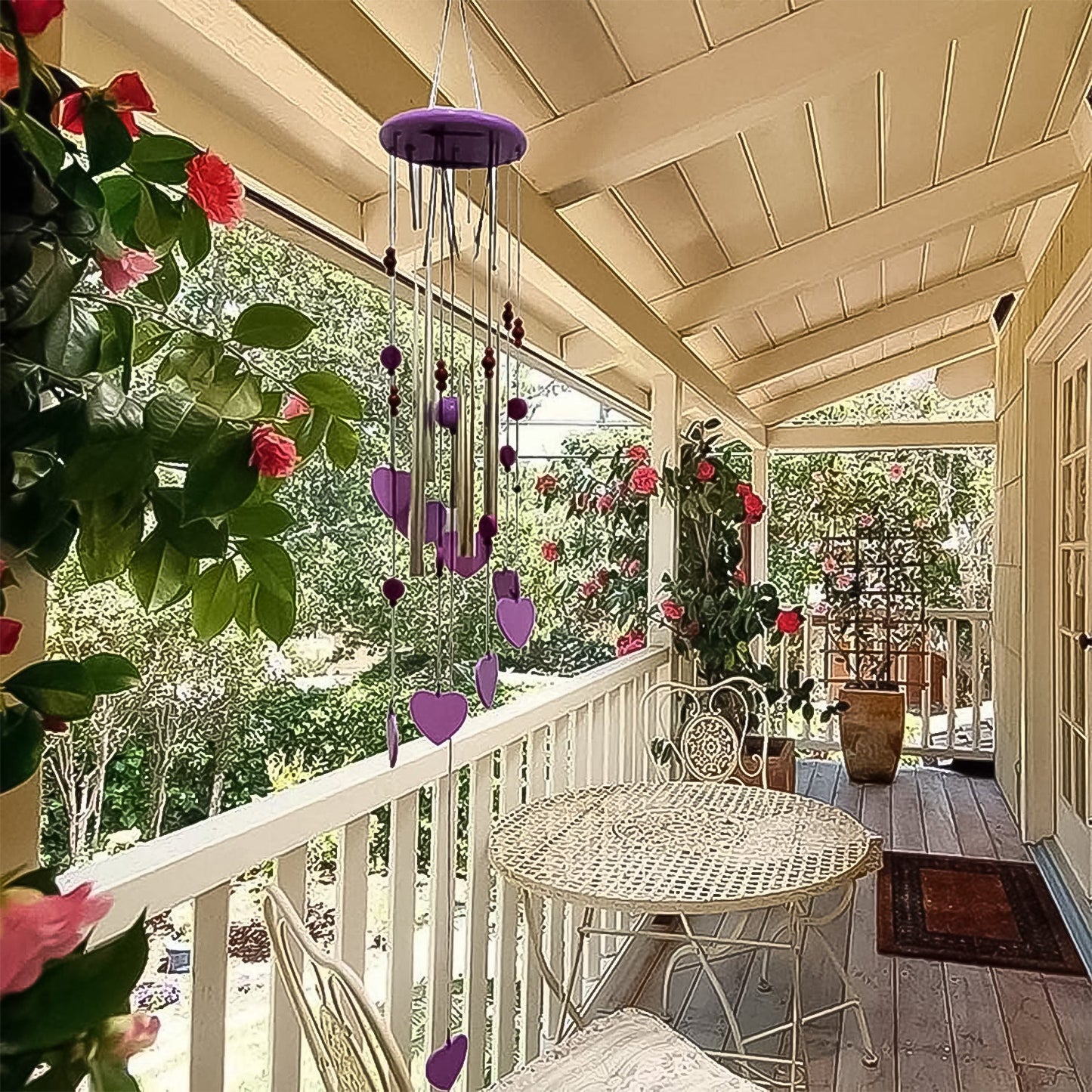 The musical wind chime with five aluminium tubes swaying gently in the breeze.