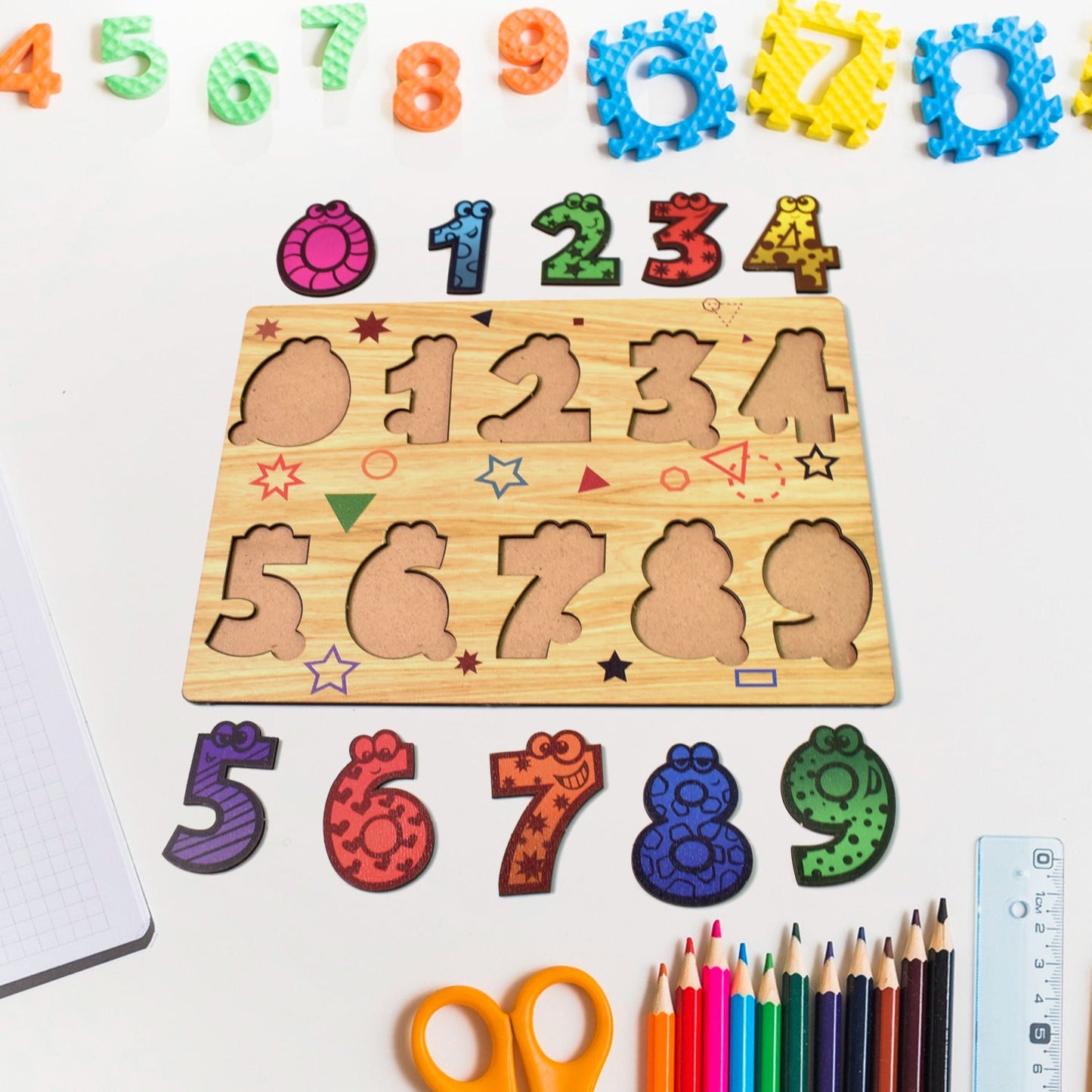 Wooden puzzle board displaying animal-shaped pieces with knobs