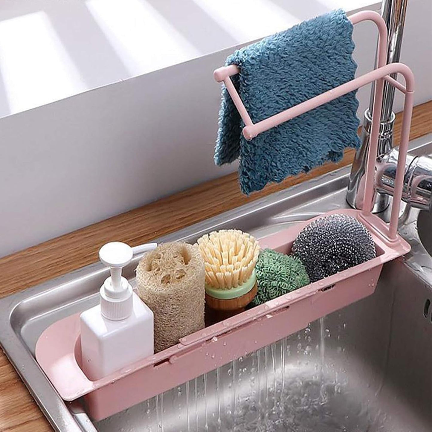 Kitchen sink organizer rack with towel holder and built-in drain tray for sponges and soap