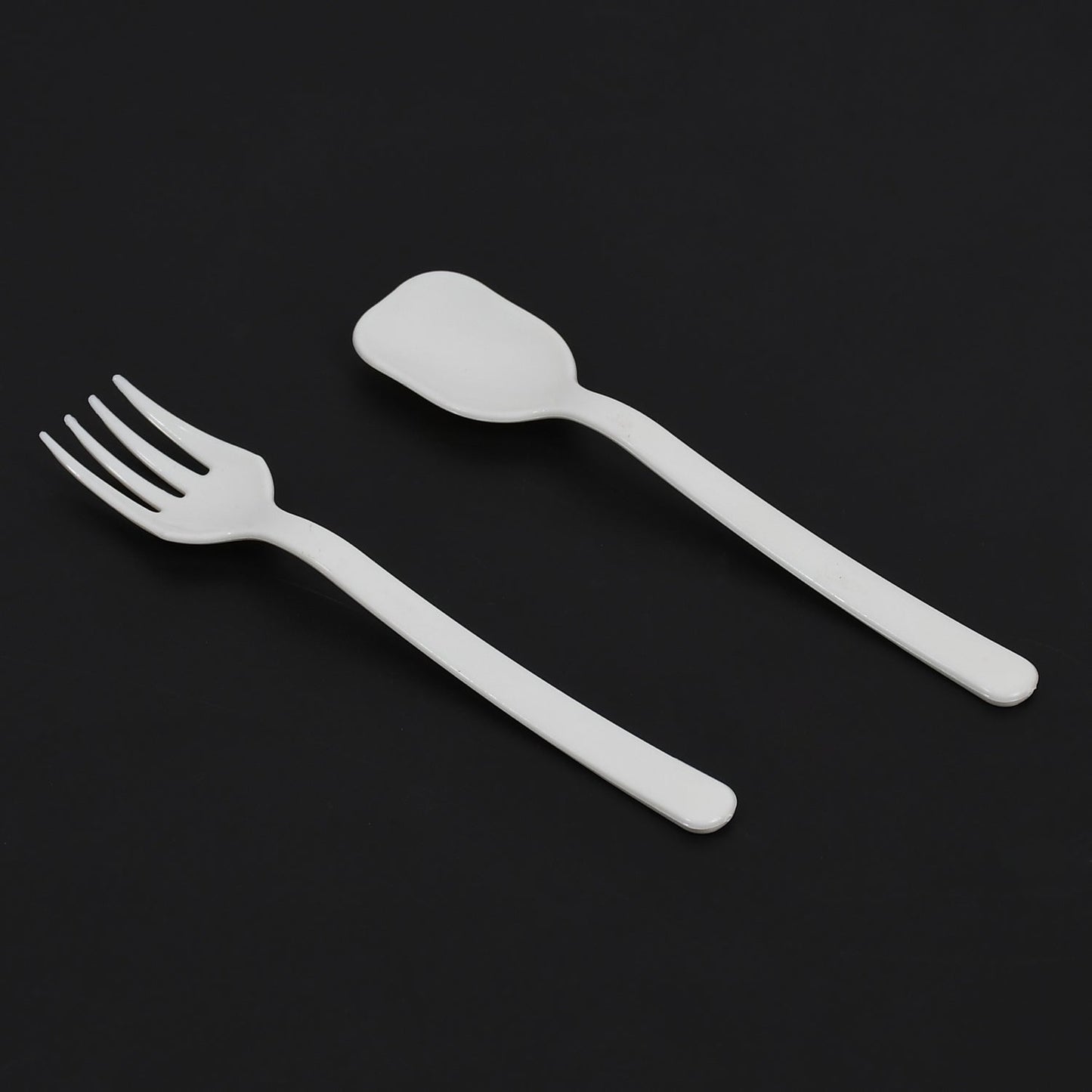 A pack of Quickslice disposable plastic forks and spoons, ideal for party supplies.