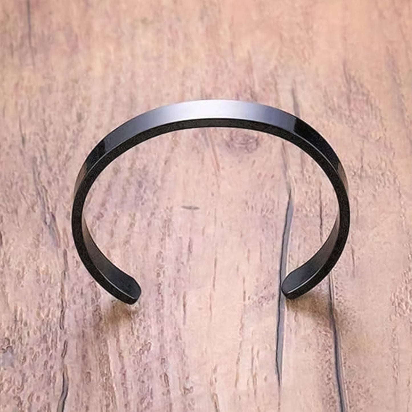 Side view of stylish black-plated stainless steel men's kada bracelet