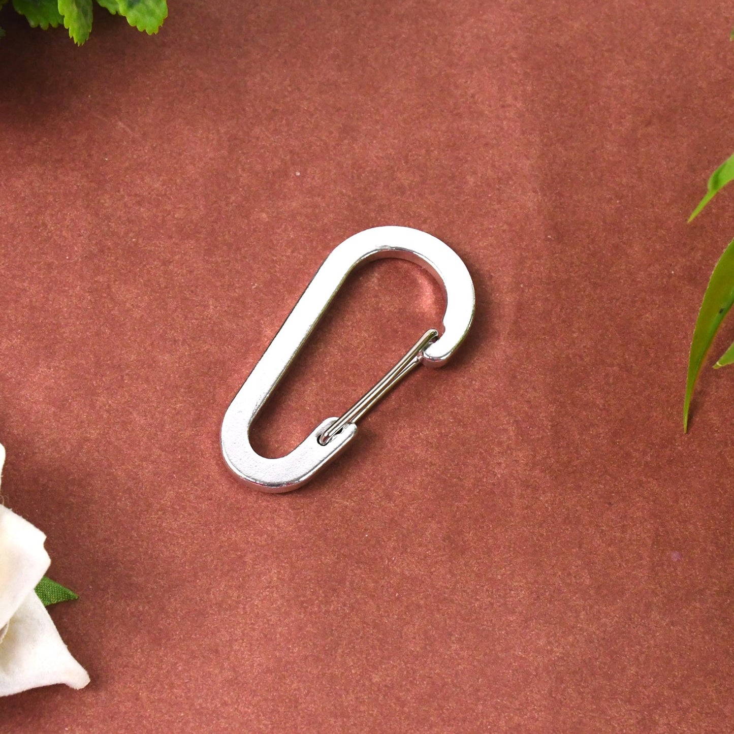 Small snap hook clasp with spring mechanism for easy use