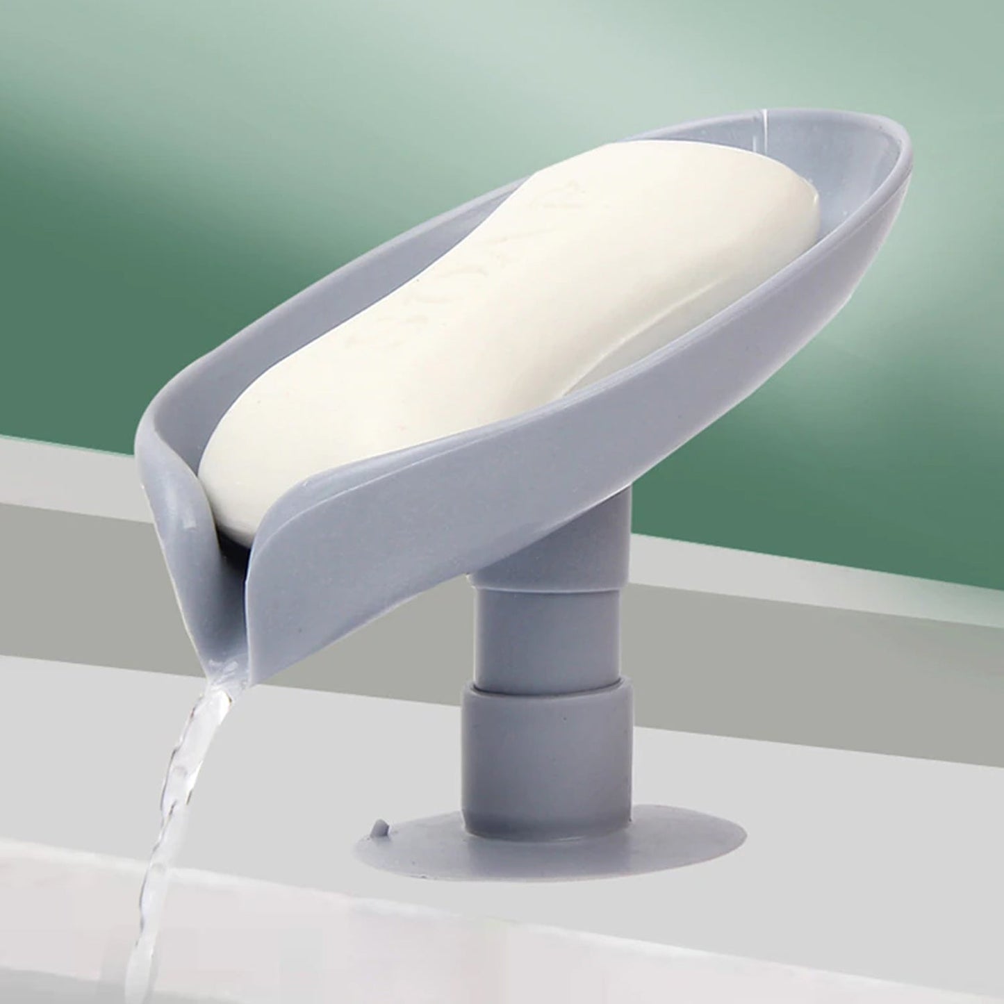 Close-up of the strong suction cup on the leaf-shaped bathroom soap dish, ensuring stable placement.