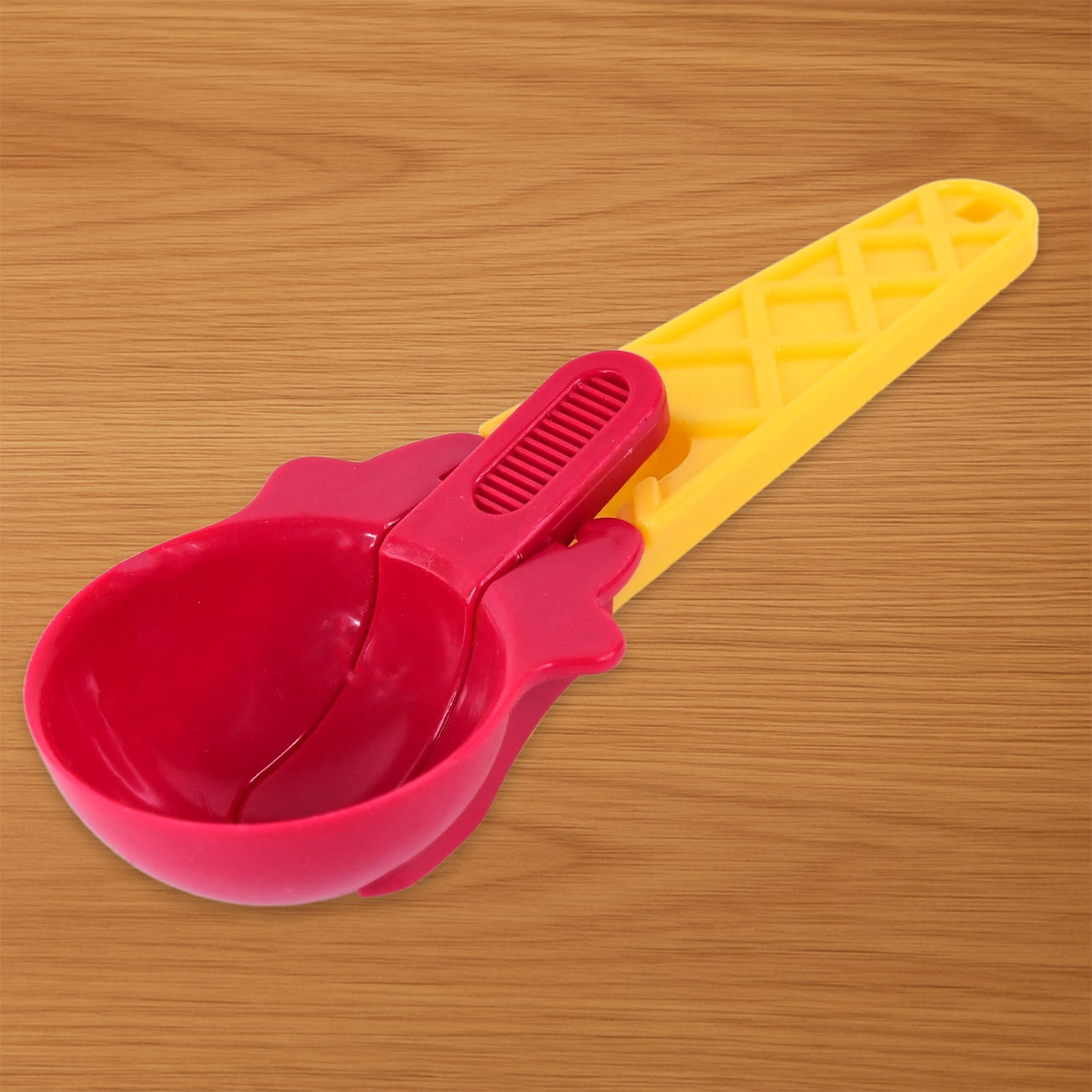 Close-up of ice cream scooper's easy-trigger release handle