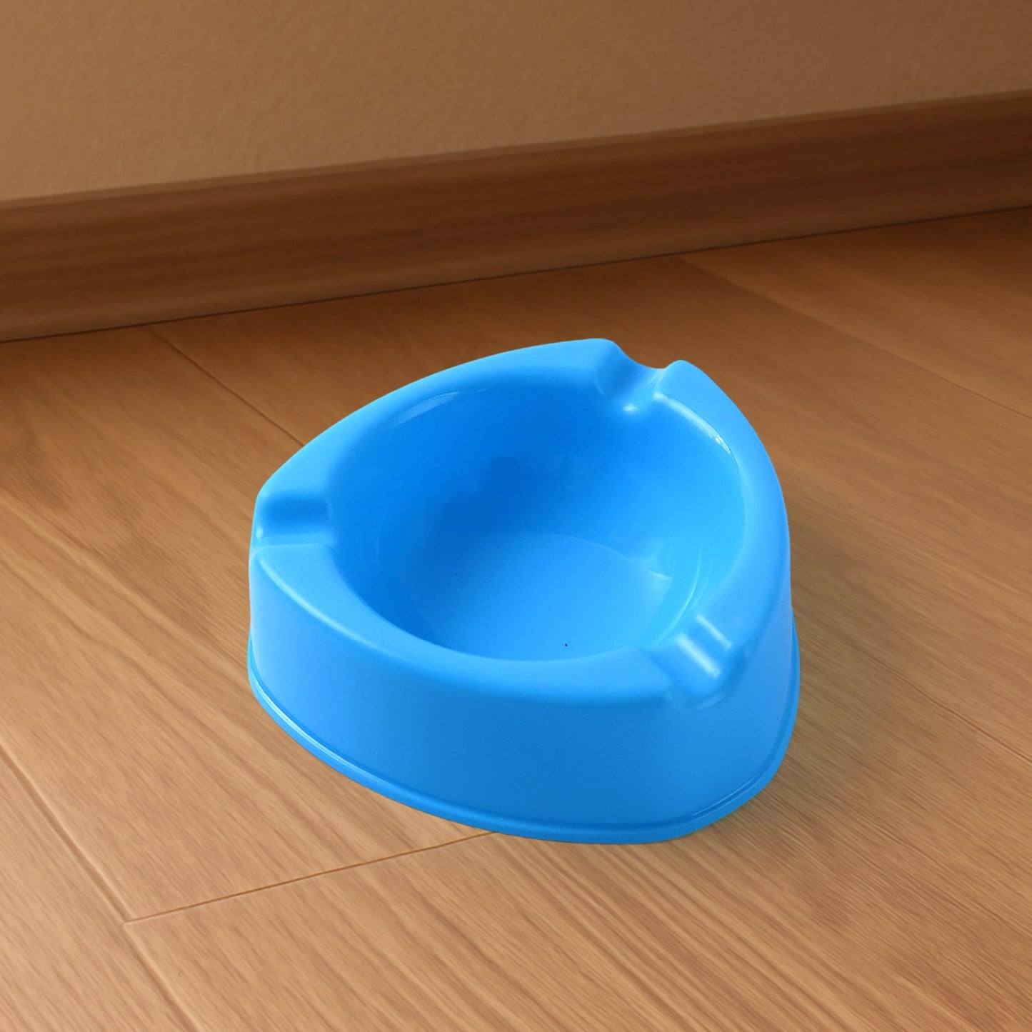 Plastic ashtray with wide bowl and cigarette rest slots in sky blue